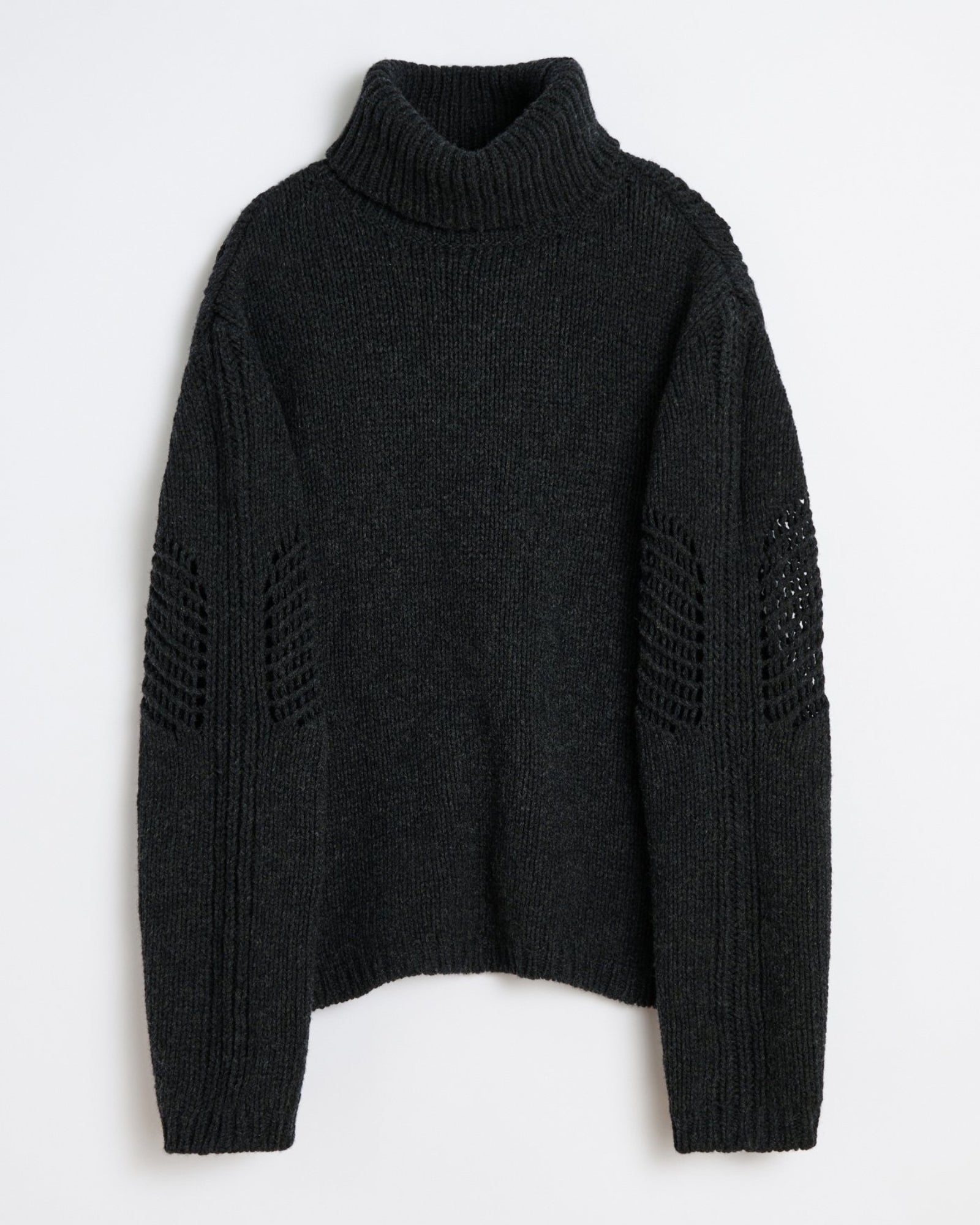 The Our Legacy Cage Rollneck in Charcoal Low Twist Merino is a turtleneck sweater with long sleeves, ribbed cuffs and hem, plus open-knit detailing on the upper arms. Shown flat against a white background.