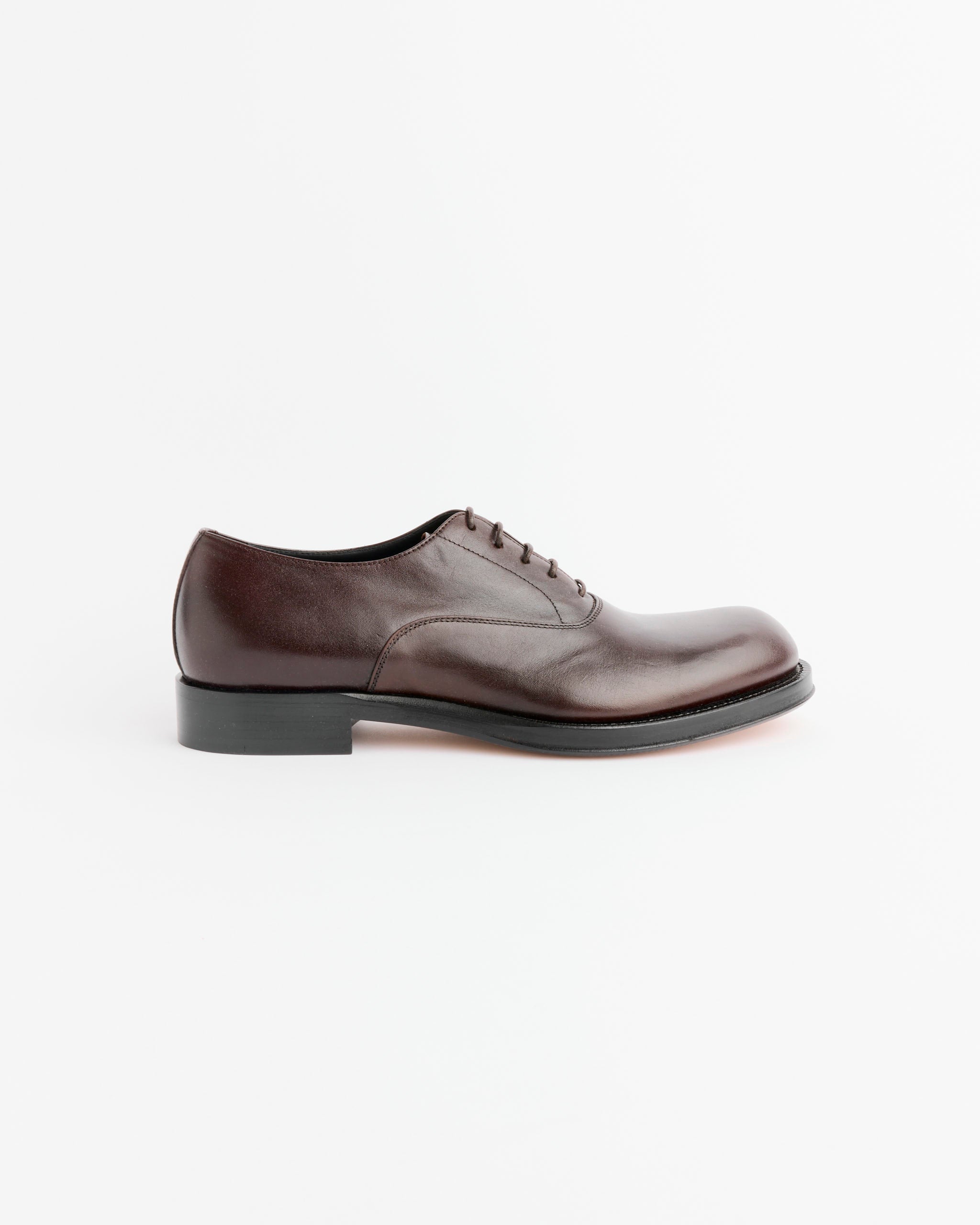 A single Dries Van Noten Laced Oxford in Dark Brown, shown in profile on a plain white background.