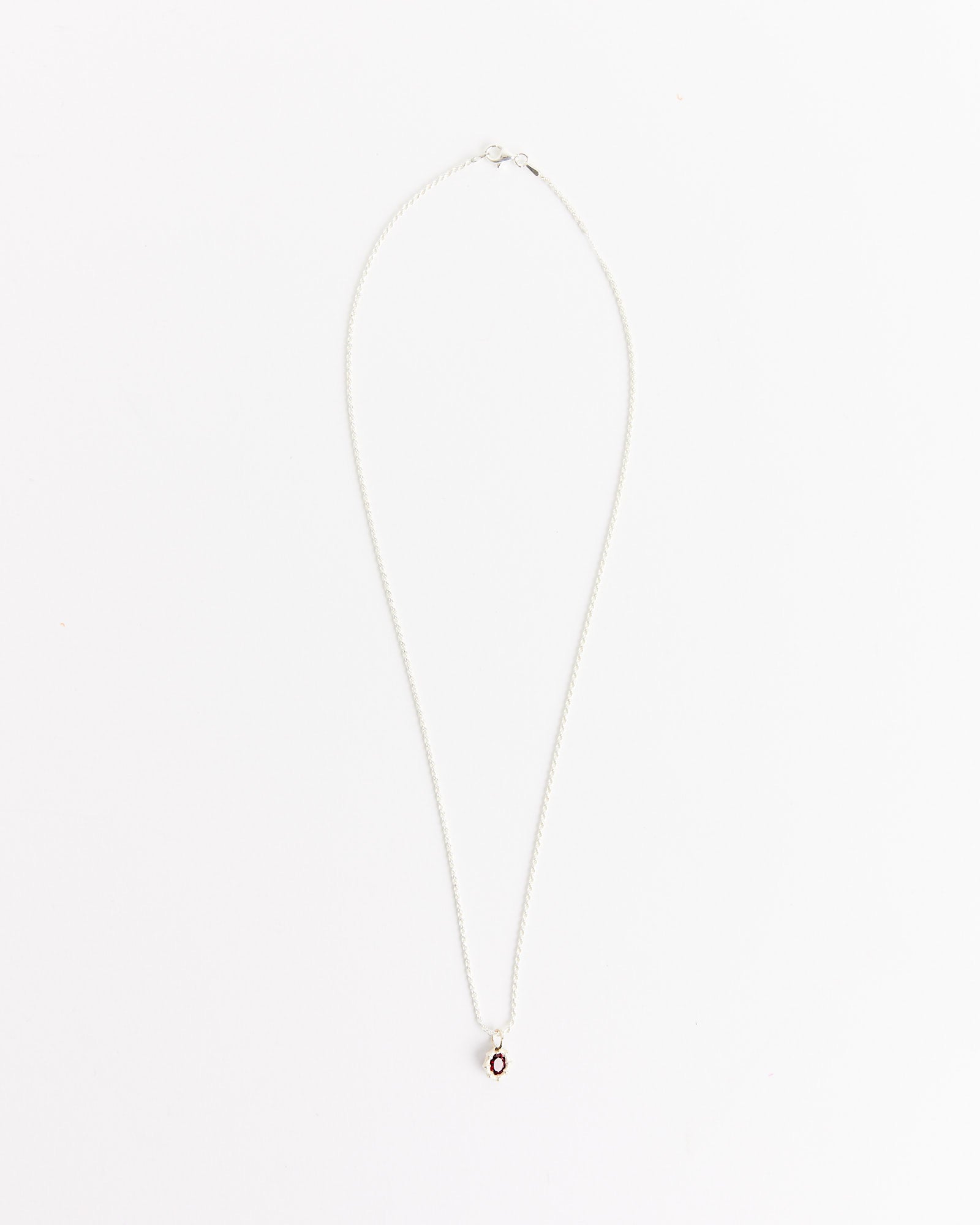 The Mini Bamboo Pendant in Silver/Red by Bleue Burnham features a delicate 20-inch silver chain with a small round pendant and red center, shown against a plain white background.