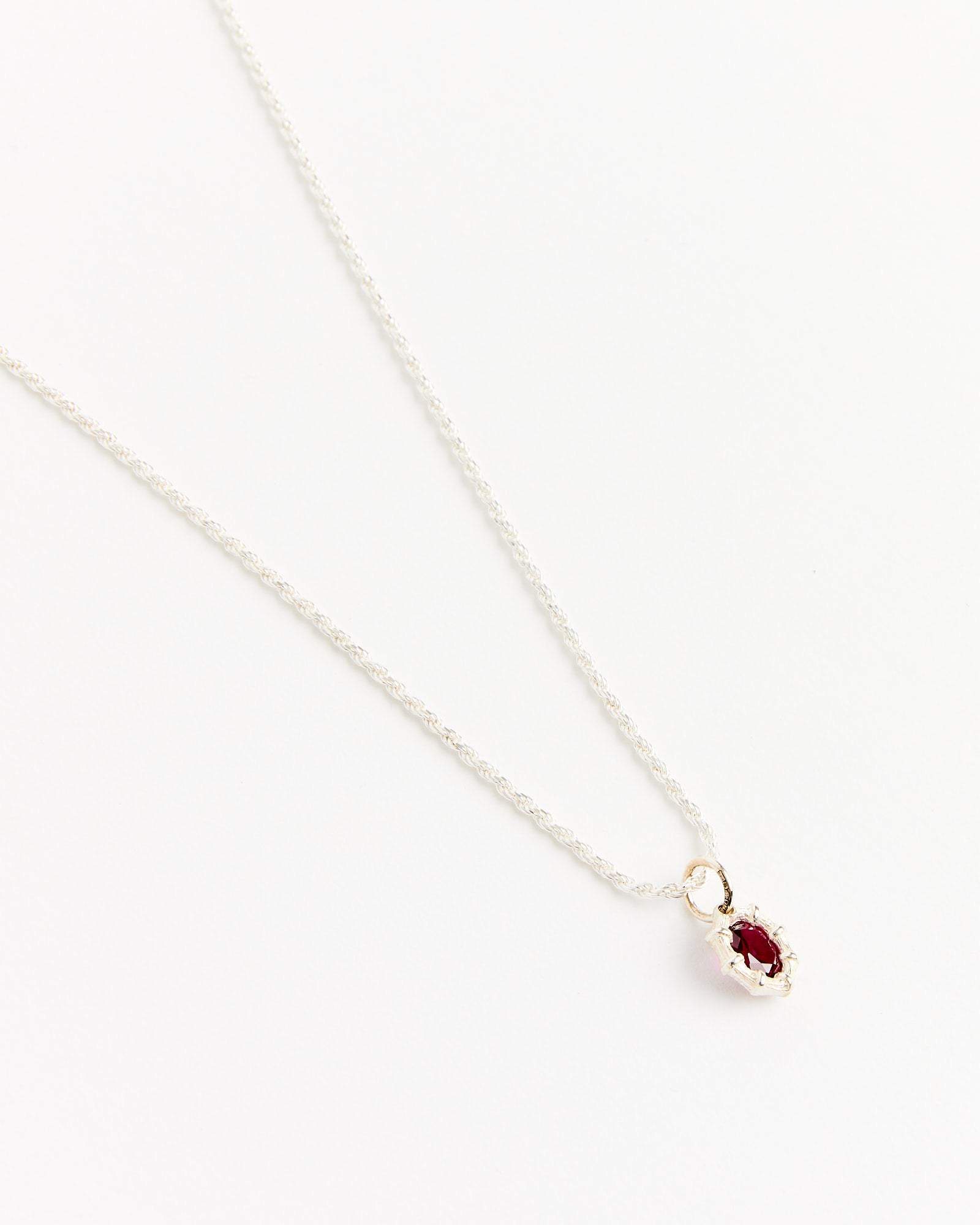 The Bleue Burnham Mini Bamboo Pendant in Silver/Red features a delicate 20-inch silver chain with an oval red gemstone in a decorative silver frame, shown on a white background.