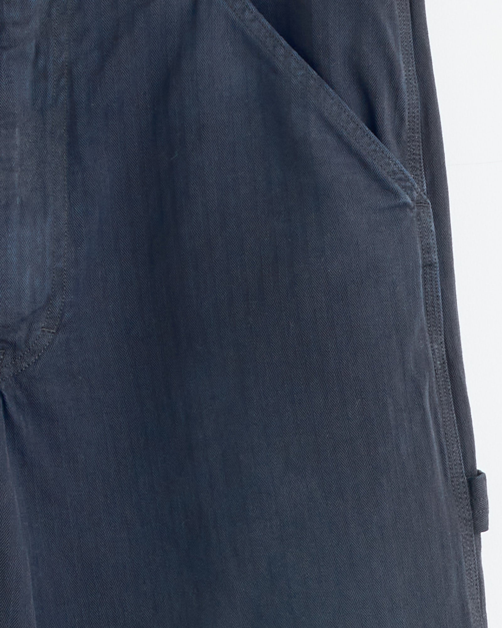 Close-up of the Maison Margiela 5 Pockets Pant in Blue, showing detailed stitching and a pocket. Shot against a light background, this piece highlights the brand’s commitment to quality and fit.