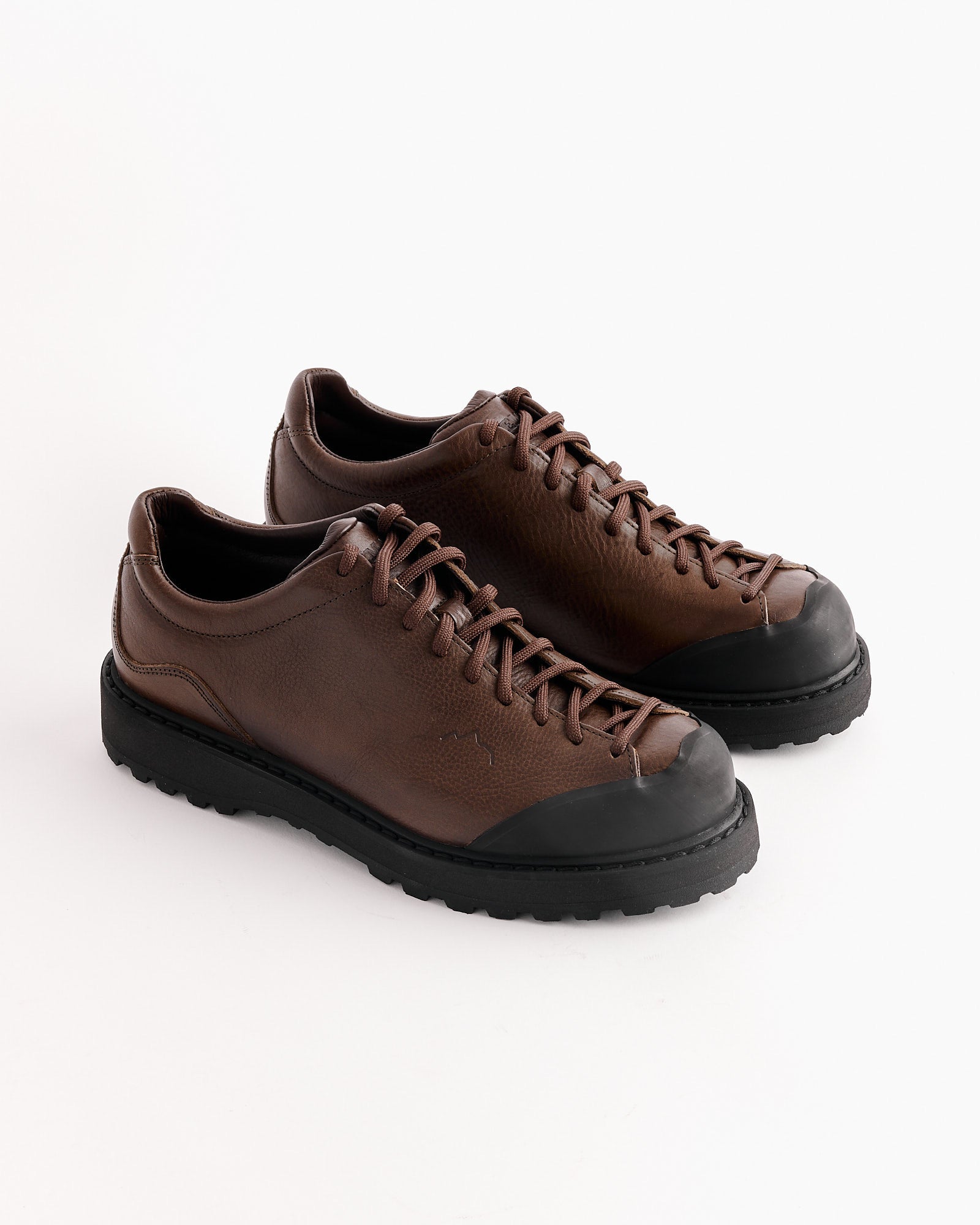 A pair of Diemme Ampezzo Shoes in Brown, crafted from premium leather with black rubber soles and toe caps, dark brown laces, and a textured finish, are displayed on a plain white background.