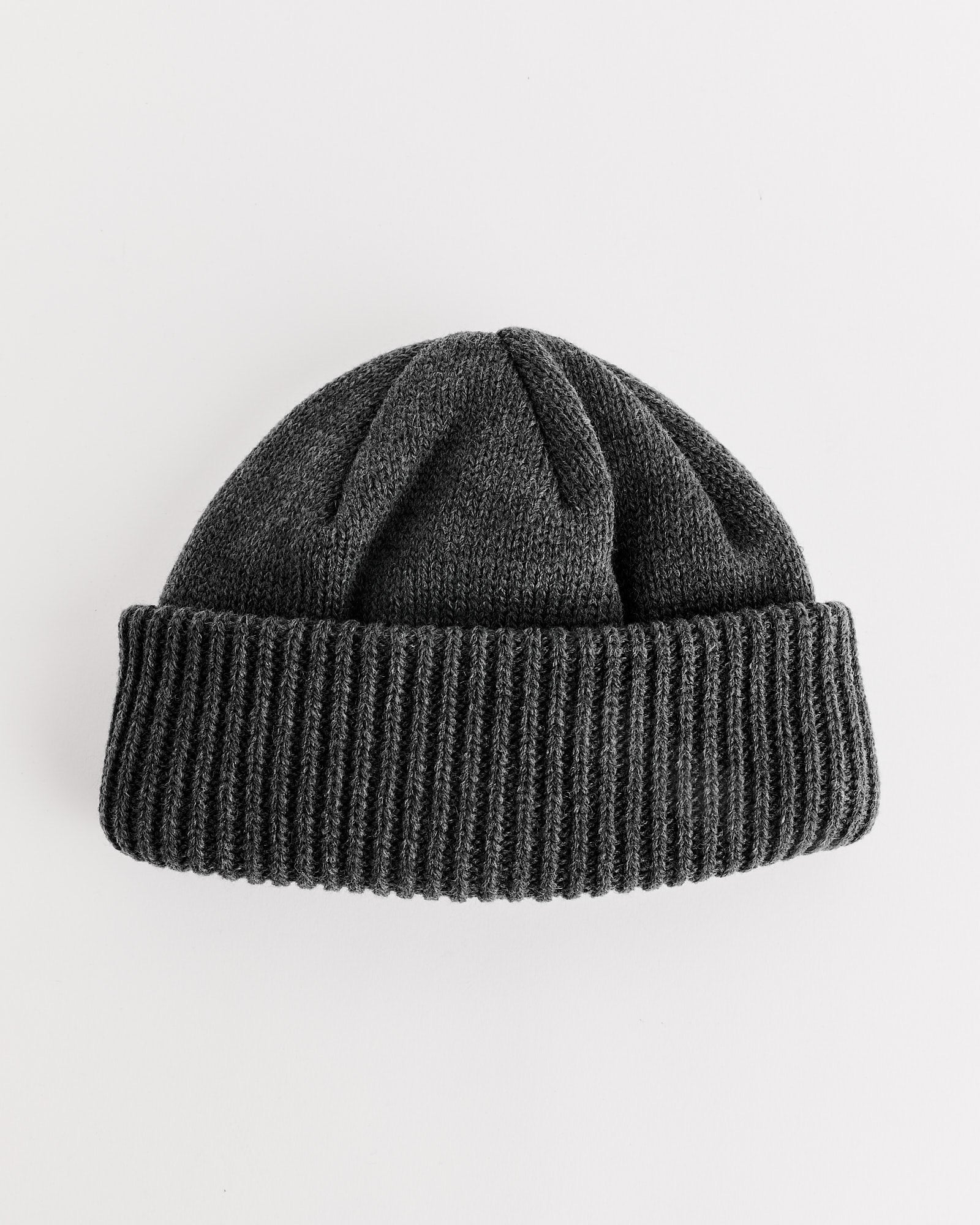 The Nanamica WINDSTOPPER® Beanie in Heather Grey, a lightweight knit with a wide, folded ribbed brim, is shown on a white background.