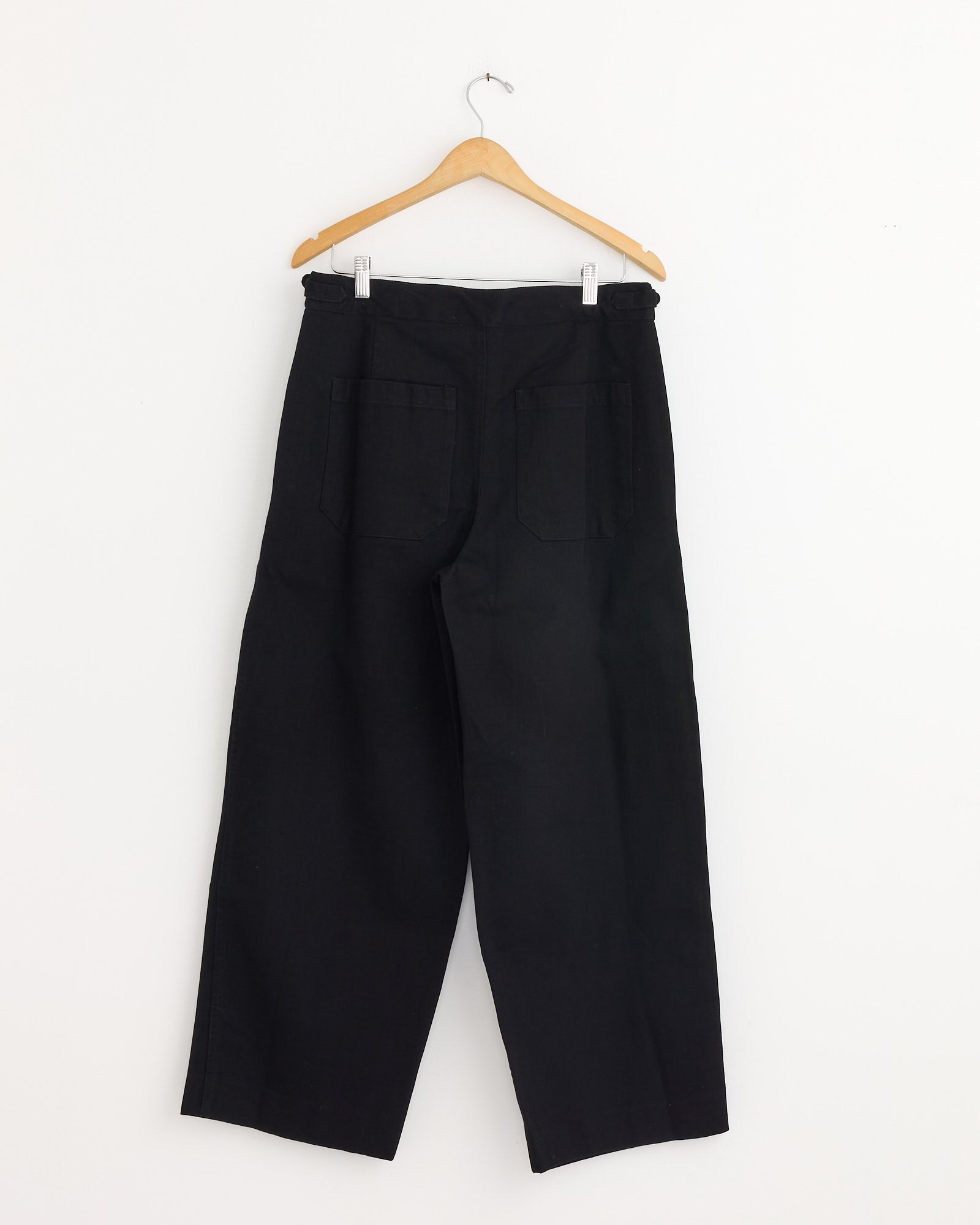 The Wide Leg Snap Trouser in Black by Bode features a vintage-inspired design, crafted from heavyweight twill.