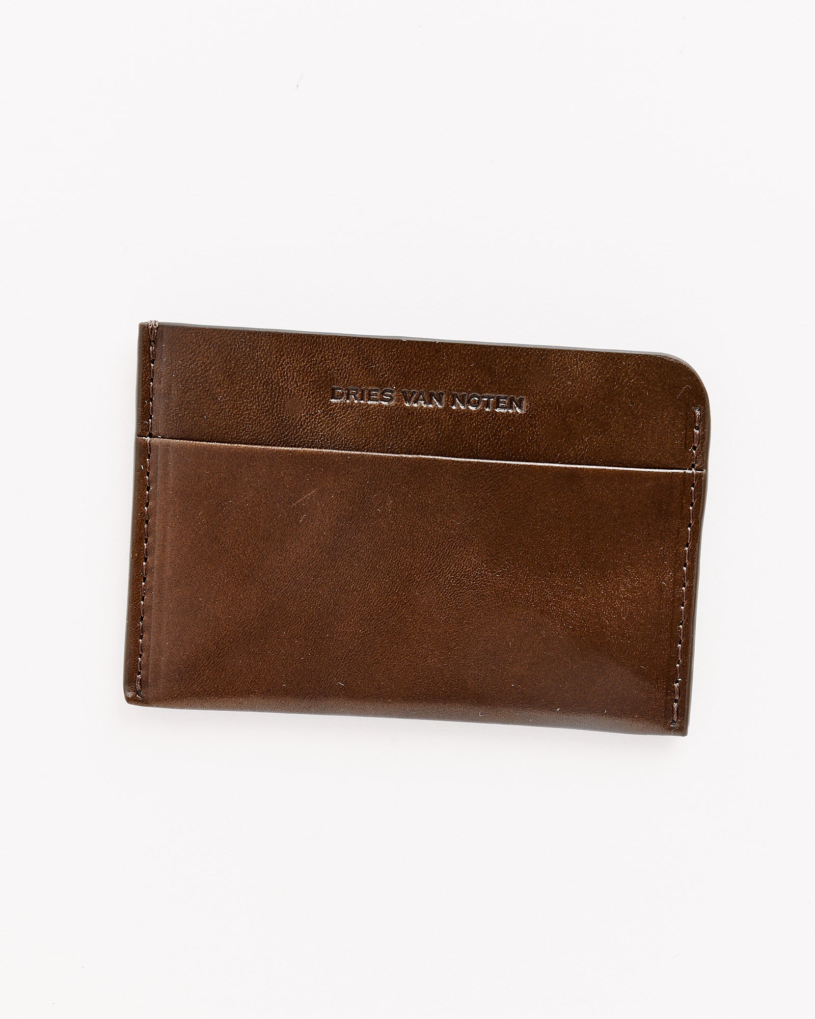 An olive 241-151 Leather Card Case by Dries Van Noten, featuring two slots and a logo embossed near the top center, shown on a white background. Made in Italy.