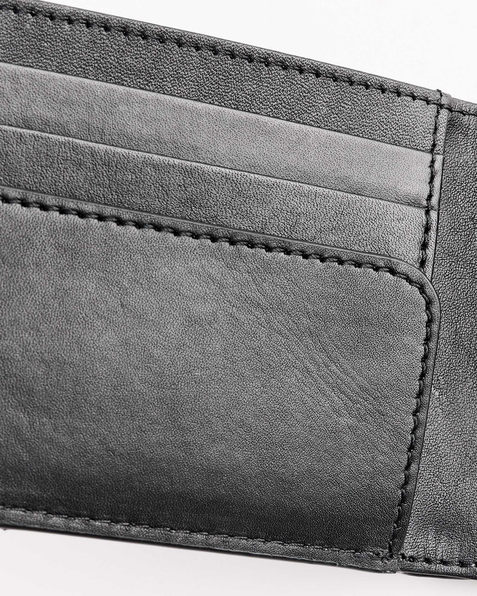 Close-up of the Dries Van Noten 995-151 Wallet in Black, featuring two card slots and detailed edge stitching.