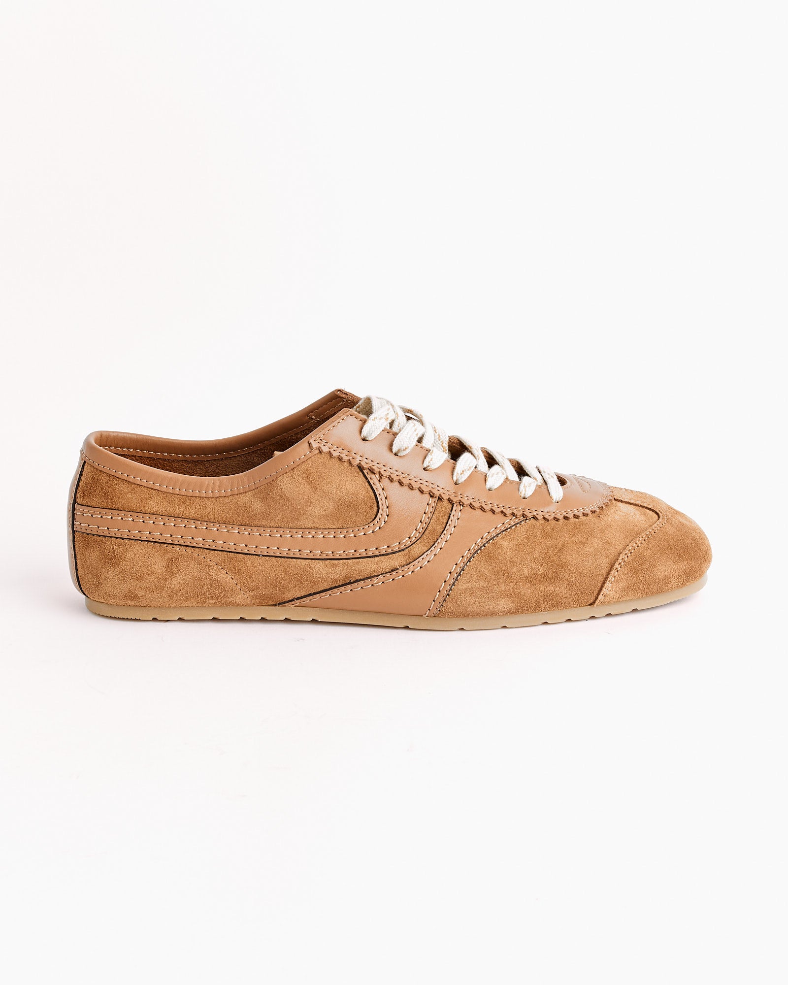 The Dries Van Noten Suede Shoes in Tan are crafted in Italy, featuring tan suede and leather, white laces, detailed stitching, and a low-profile rubber sole—shown here in a side view on a plain white background.