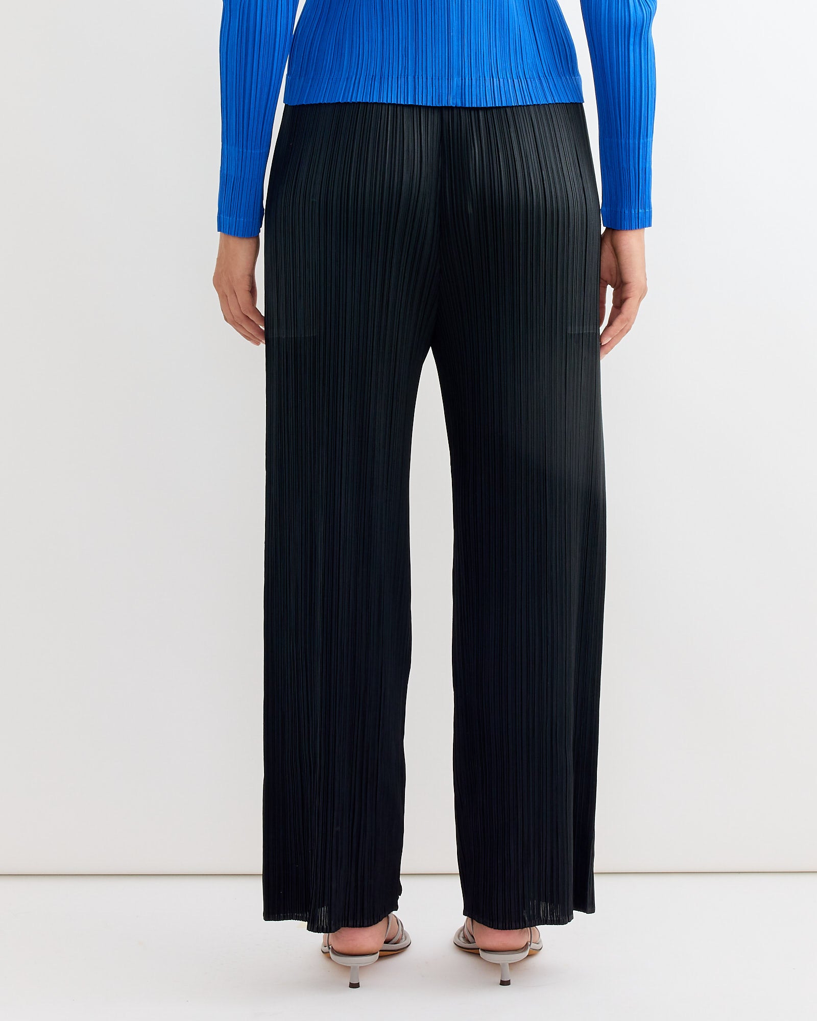 Someone wearing the Pleats Please Issey Miyake MC August Pant in Black.