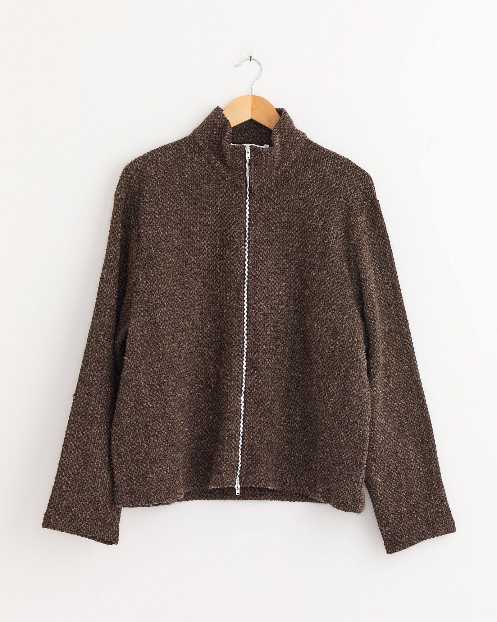 The Shrunken Full Zip Polo in Brown Sparse by Our Legacy is a brown, boxy-fit jacket crafted from textured Italian fabric and styled on a swinger.