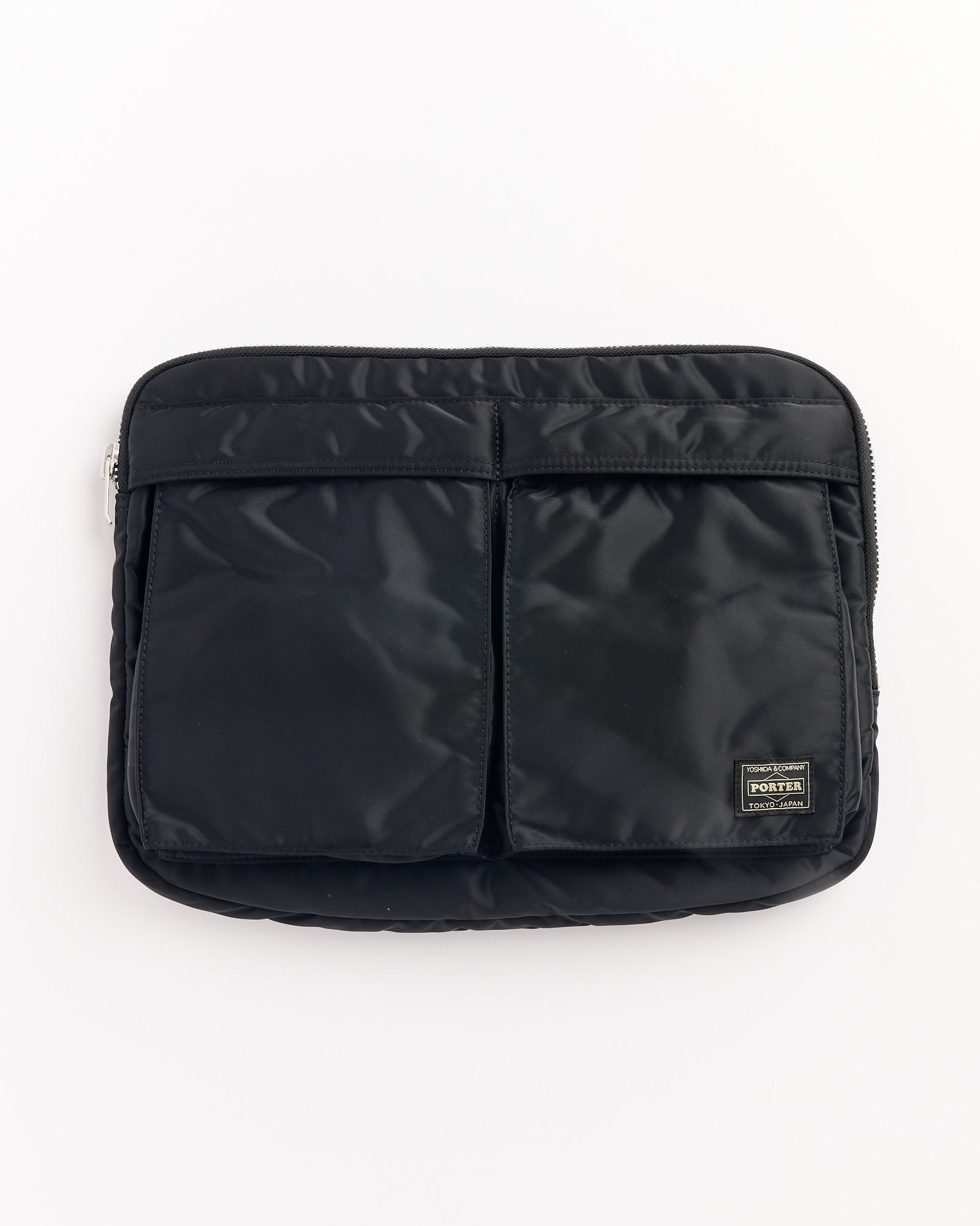 The Porter Tanker Document Case in Black is a nylon pouch with two front pockets, a zipper closure, and a PORTER label in the bottom right corner.