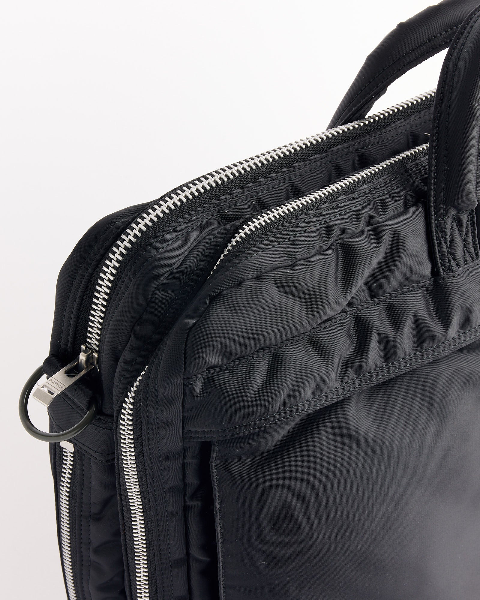A close-up of the Porter Tanker 2Way Document Zip Bag in black.
