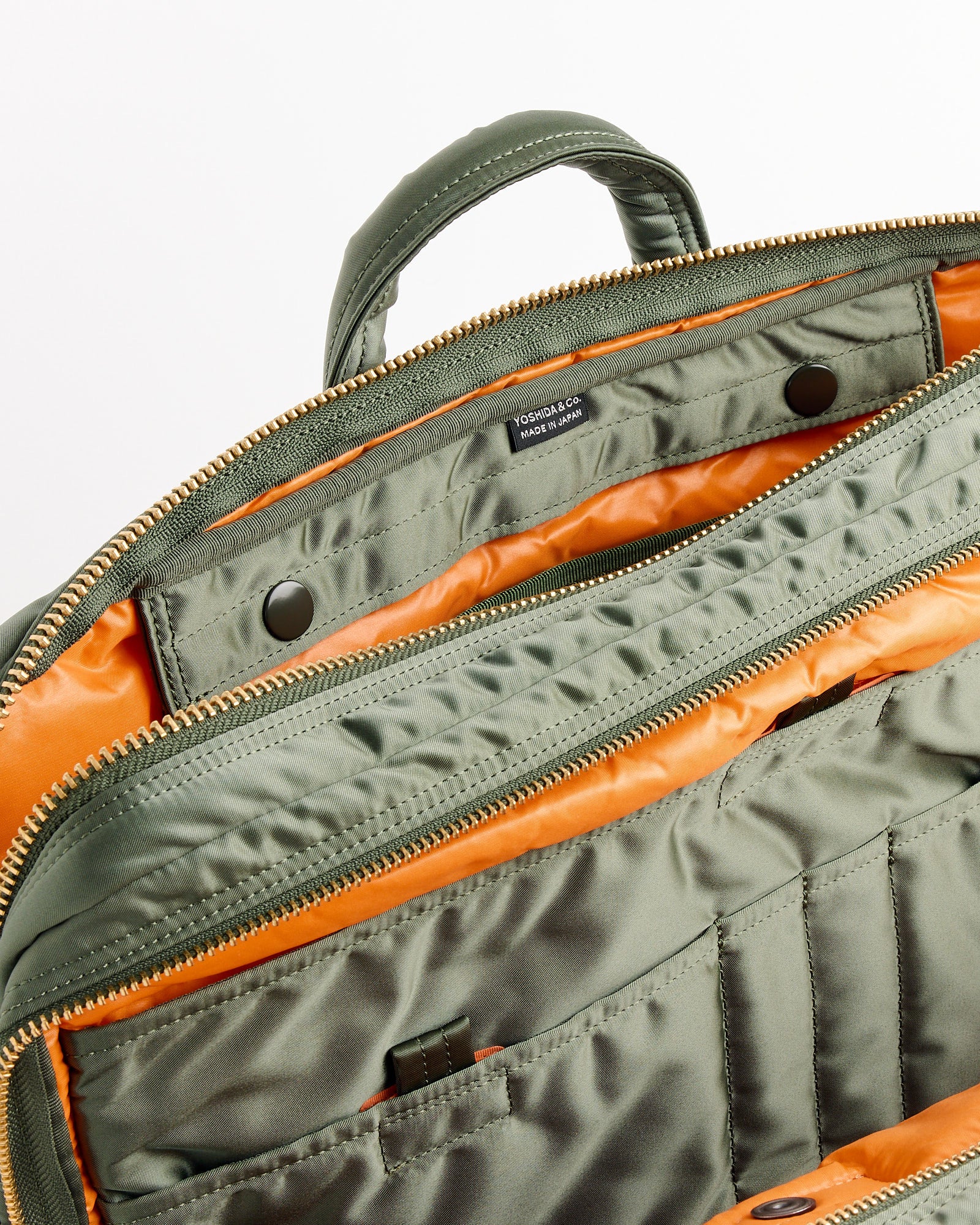A close-up of the Porter Tanker 2Way Document Zip Bag in Sage Green.