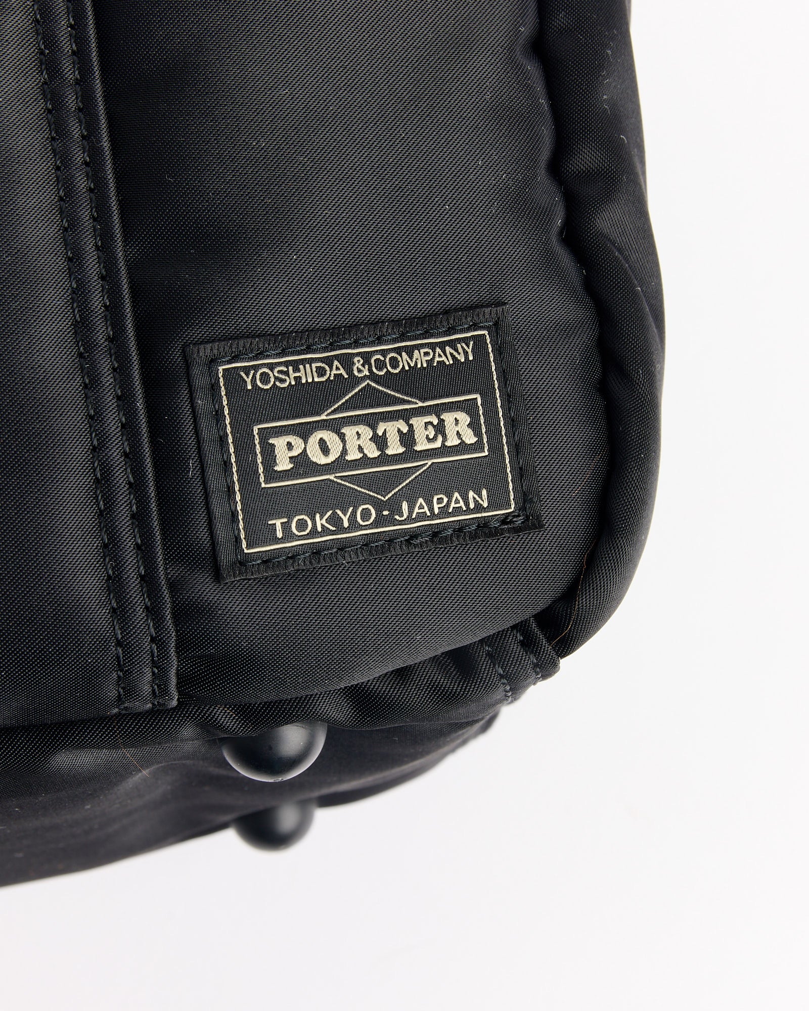 A close-up of the Porter Tanker Boston Bag in black.