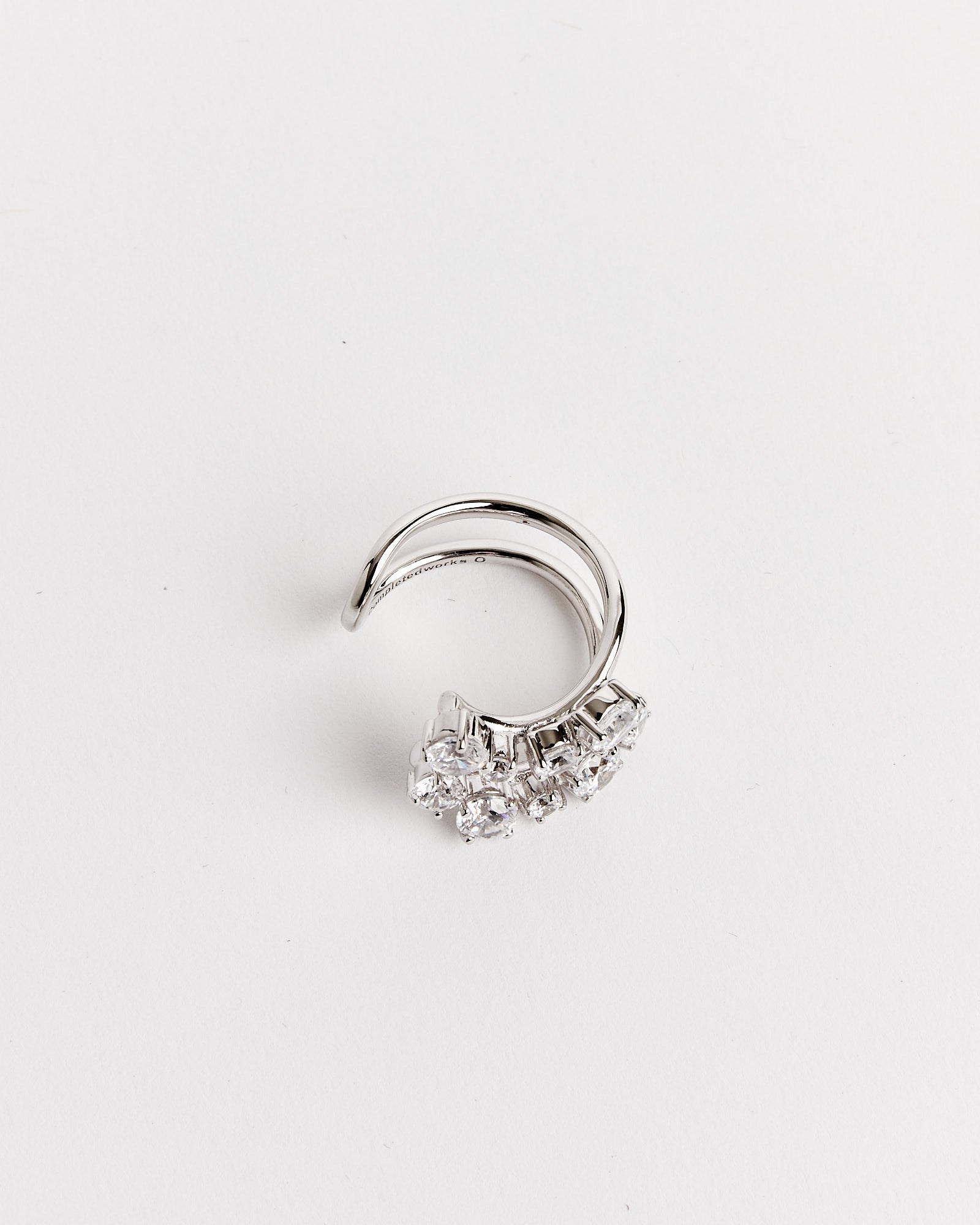 The Completedworks Recycled Silver Myth CZ Ring features sparkling stones and is available in multiple sizes for a perfect fit.