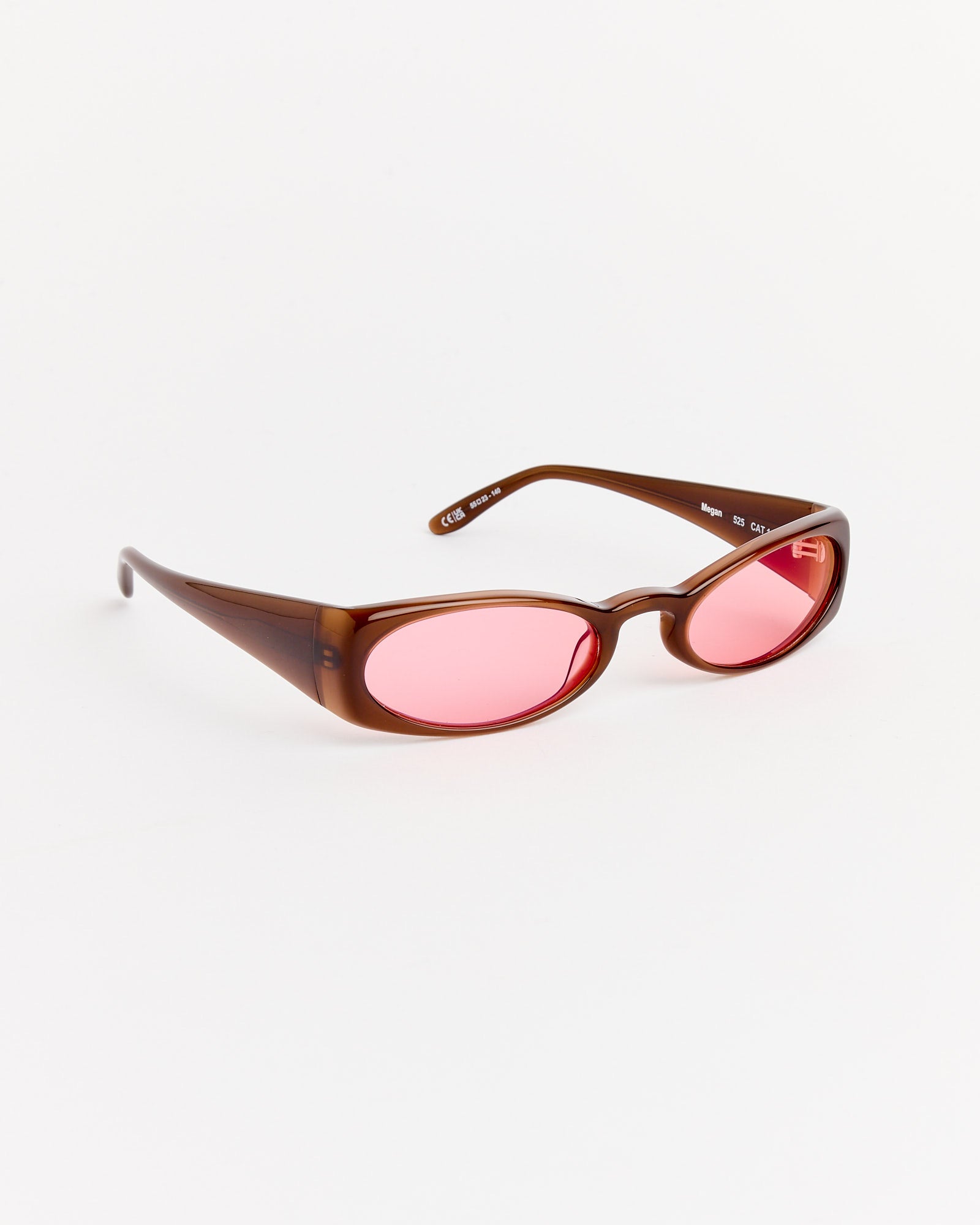 The Henrik Vibskov Megan Sunglasses in Brown/Red feature thick oval acetate frames and pink-tinted lenses, shown on a plain white background.
