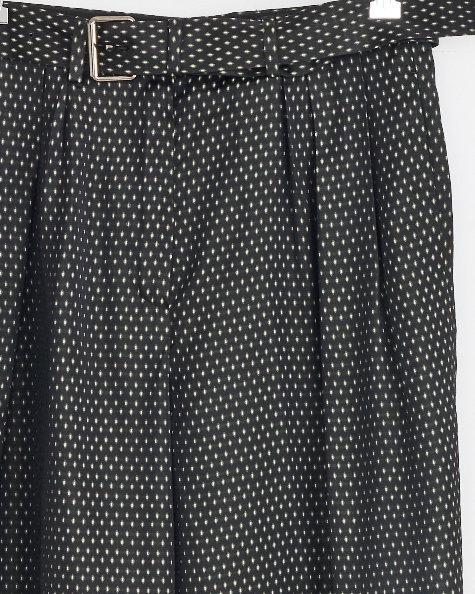 Dries Van Noten Belted Jacquard Trousers in Black feature a wide leg and an all-over small white polka dot pattern.