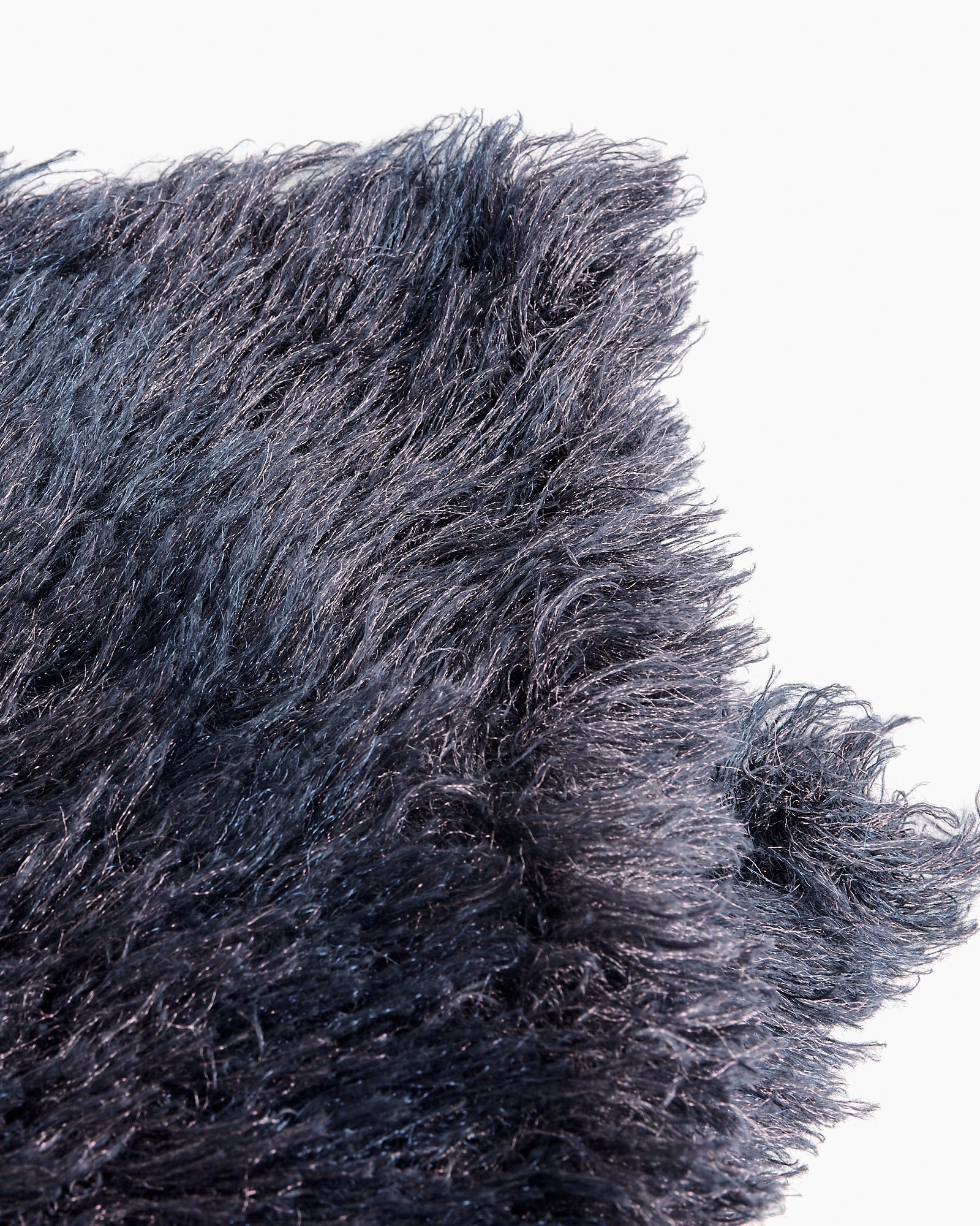 Close-up of the Tejar 2732 Scarf in Purple by Dries Van Noten, showcasing its soft, long, and shiny fibers—perfect for elevating any look. Need help with fit or sizing? Our online chat is here to assist you.