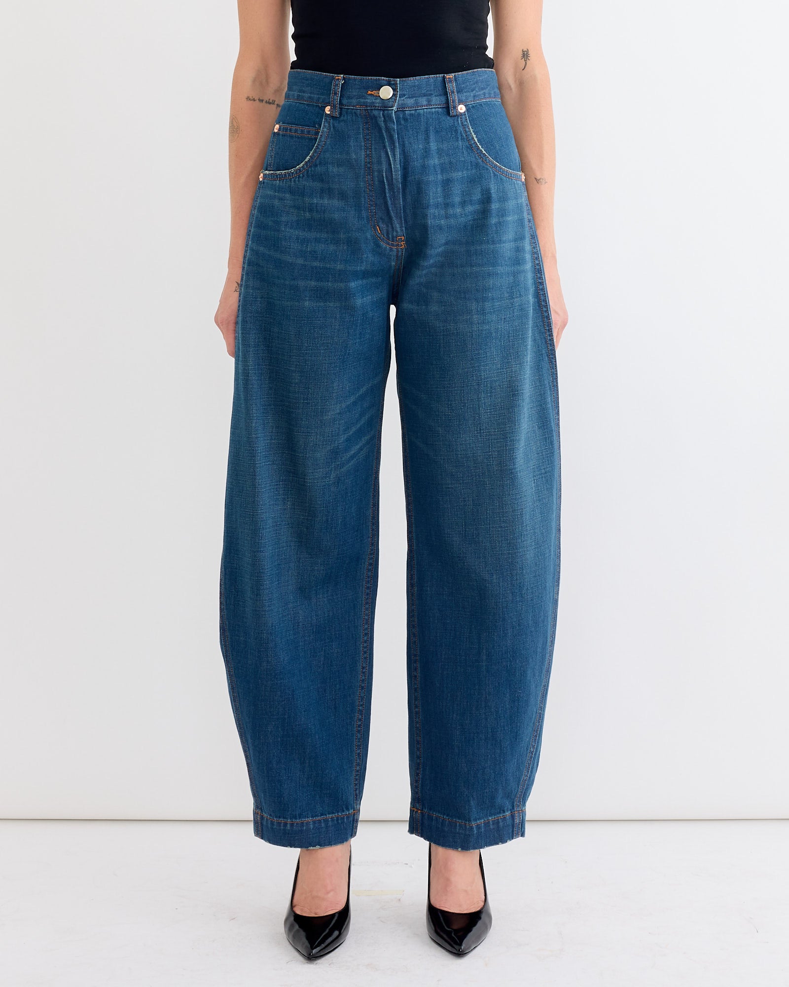 A woman wears the Keenan Pant in Vintage Indigo by Rachel Comey.