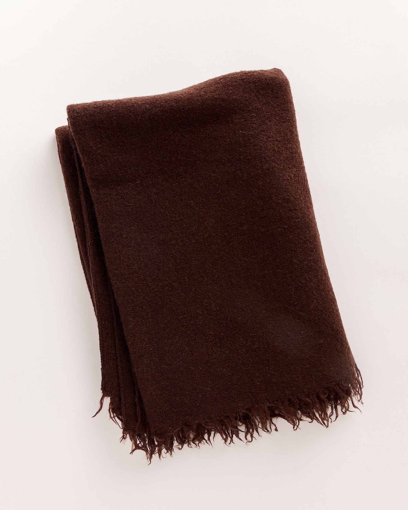 The Lauren Manoogian Felt Fringe Scarf features a soft dark brown felt texture and fringed edges, shown folded on a plain white background.