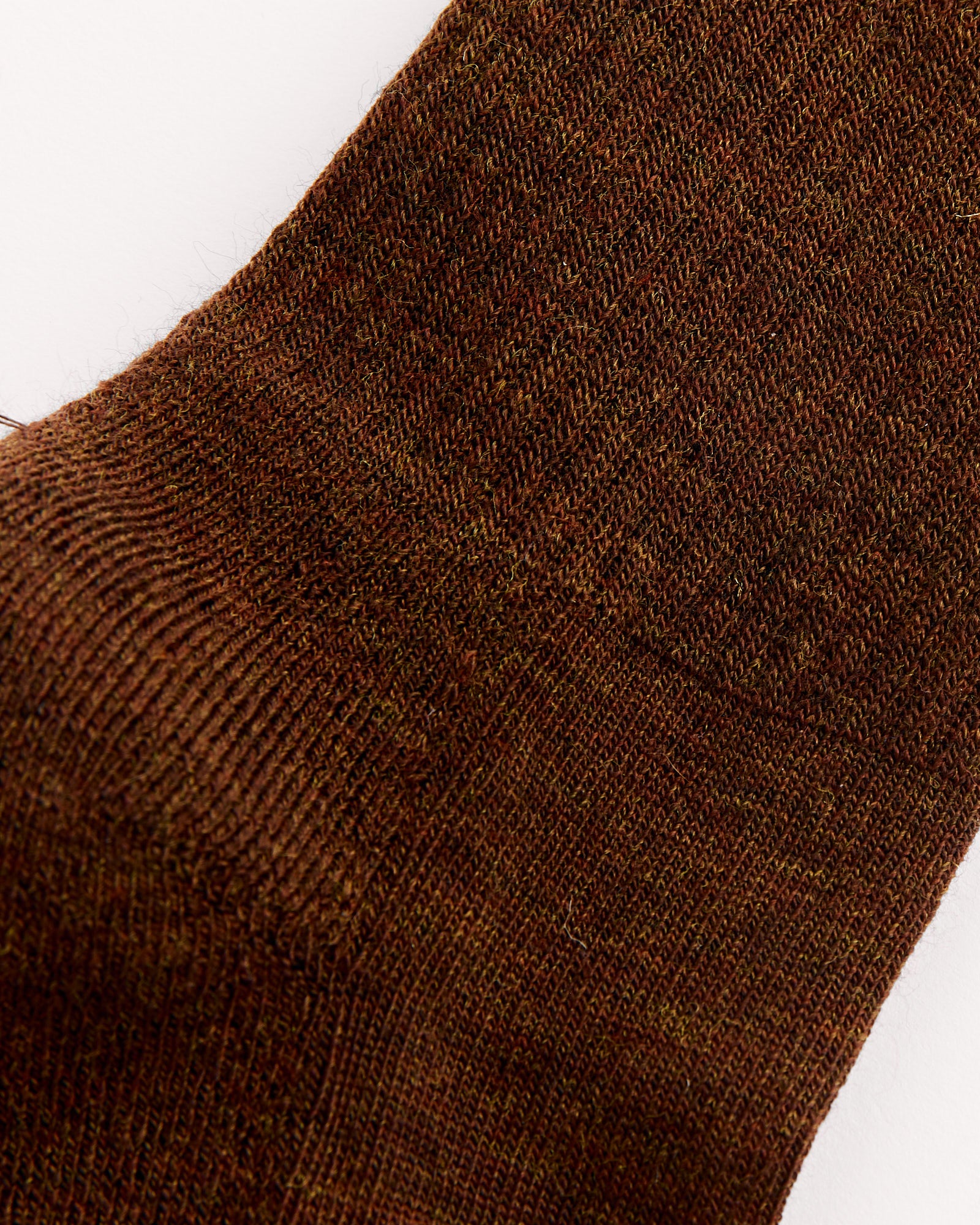 Close-up of The Tube Sock in Cocoa by Comme Si, highlighting its detailed knit texture and stitching—ideal for viewing fit and sizing.