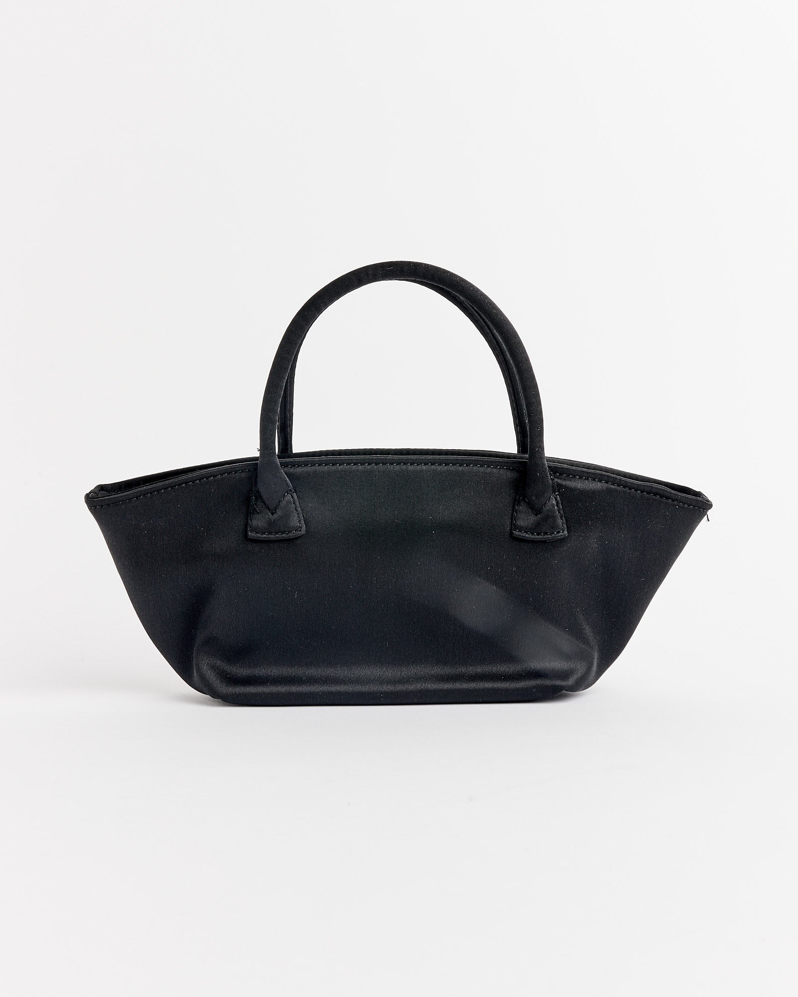 The Otte Bag in Black by Hai is a small, structured handbag with two short handles and a minimalist design, shown against a plain white background.