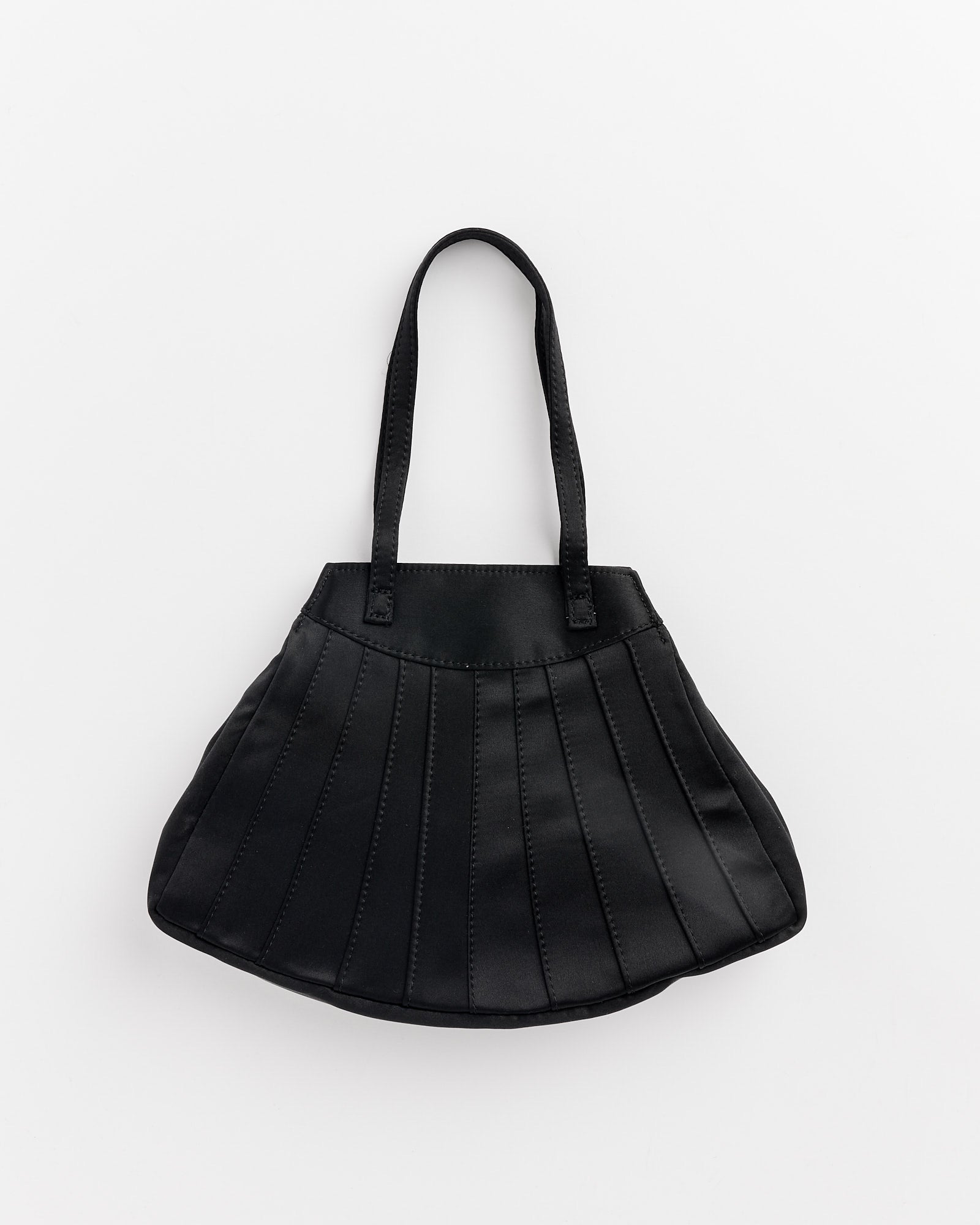 The Hai Farfalle Bag in Black is a fan-shaped bag with two handles, vertical stitched panels, and a slightly flared bottom, shown on a plain white background.