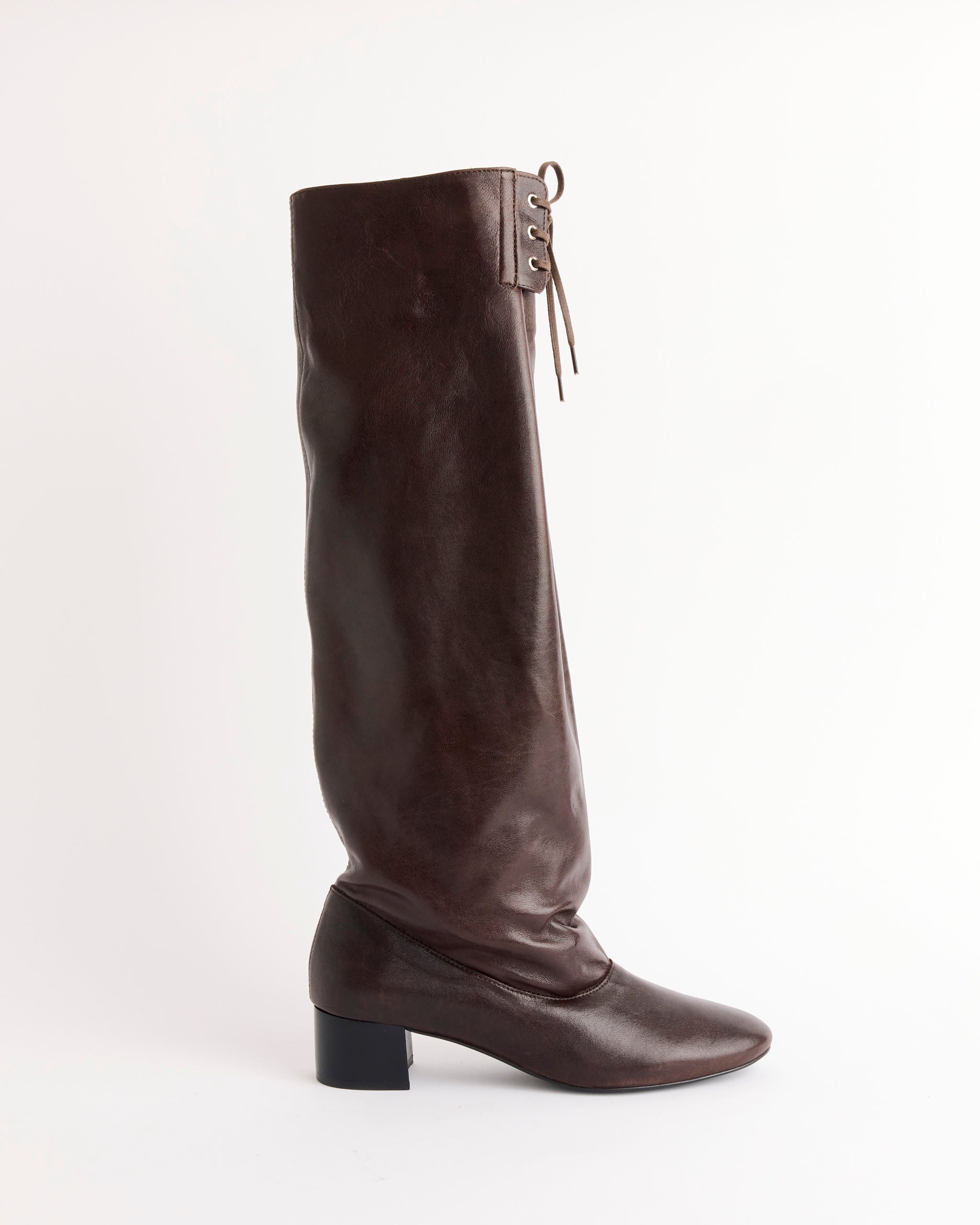 A single Paloma Wool Victoria Boot in brown leather, with a low block heel and front laces, is displayed against a plain white background.