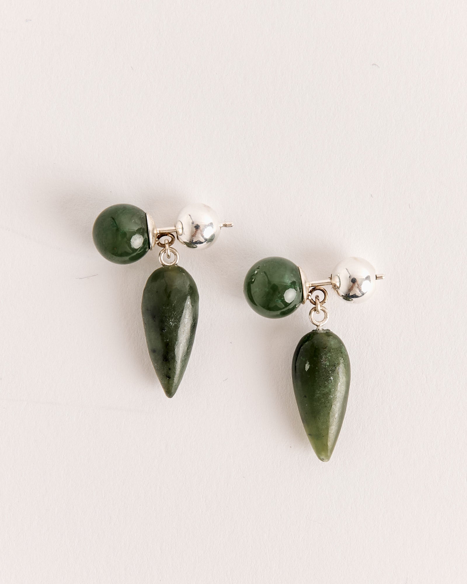The Tiny Phoenician Earrings in Jade by Sophie Buhai feature round silver and green beads at the top with dark green jade drop pendants, displayed against a light background.