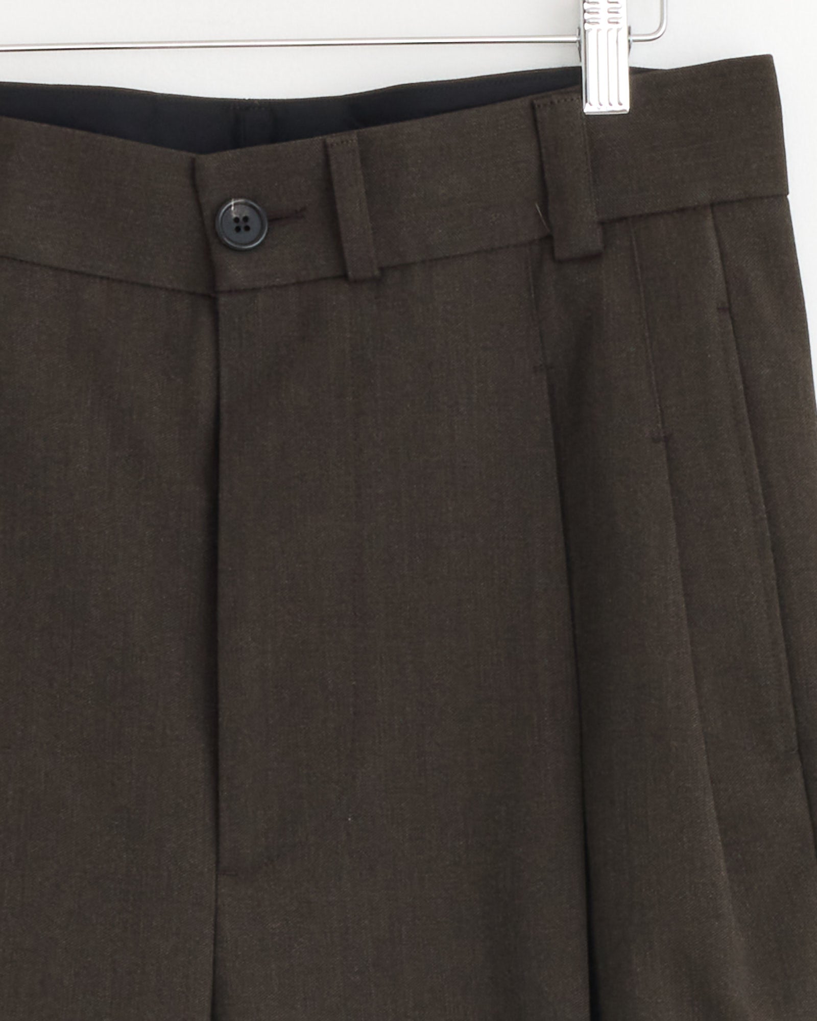 A close-up of the Stitch Pleat Trouser in Khaki Brown by Margaret Howell, made in Italy.