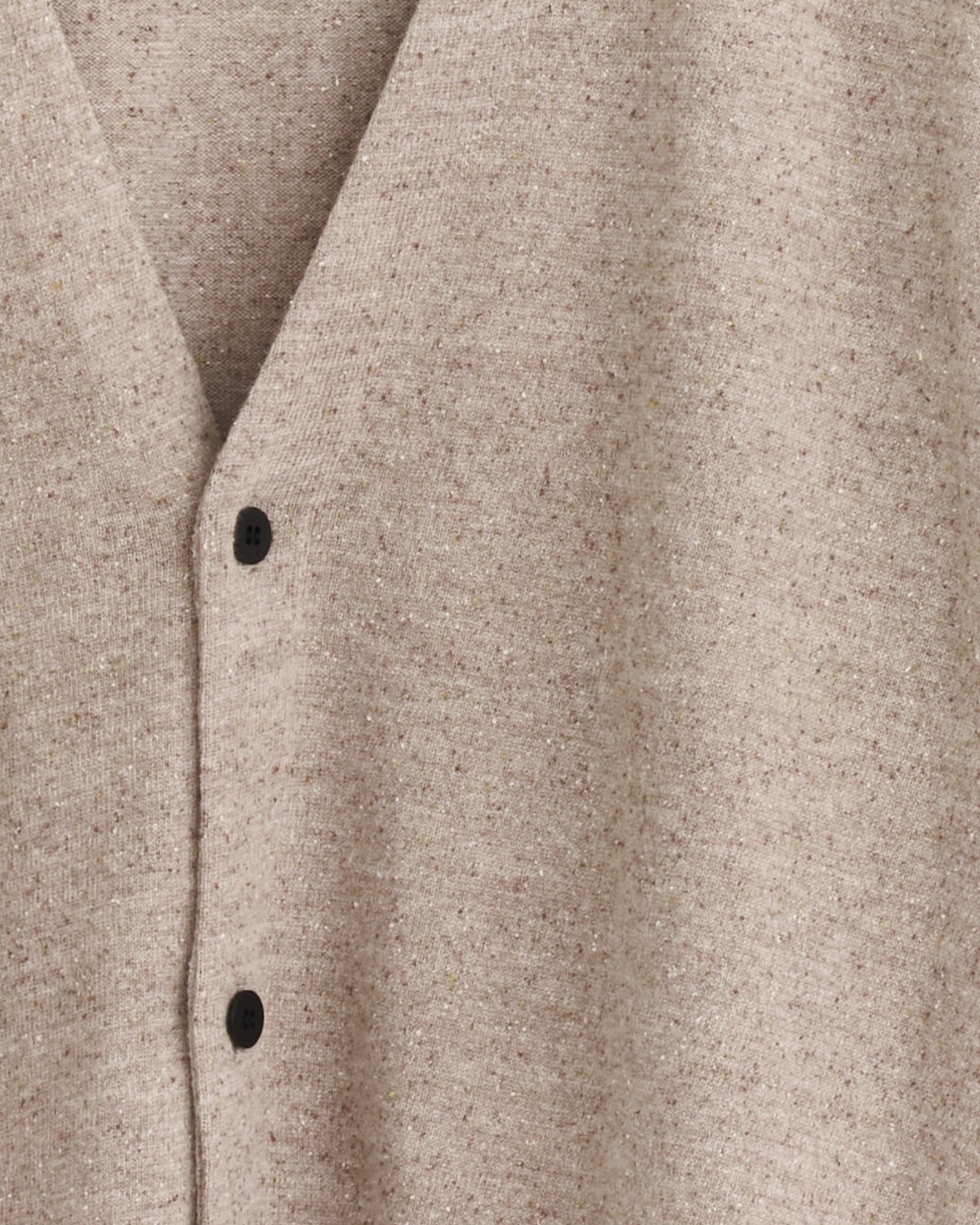 Close-up of the Still By Hand Silk Mixed 2B Cardigan in Sand Beige, featuring a V-neckline, two black buttons on the front, and crafted from soft jersey fabric.