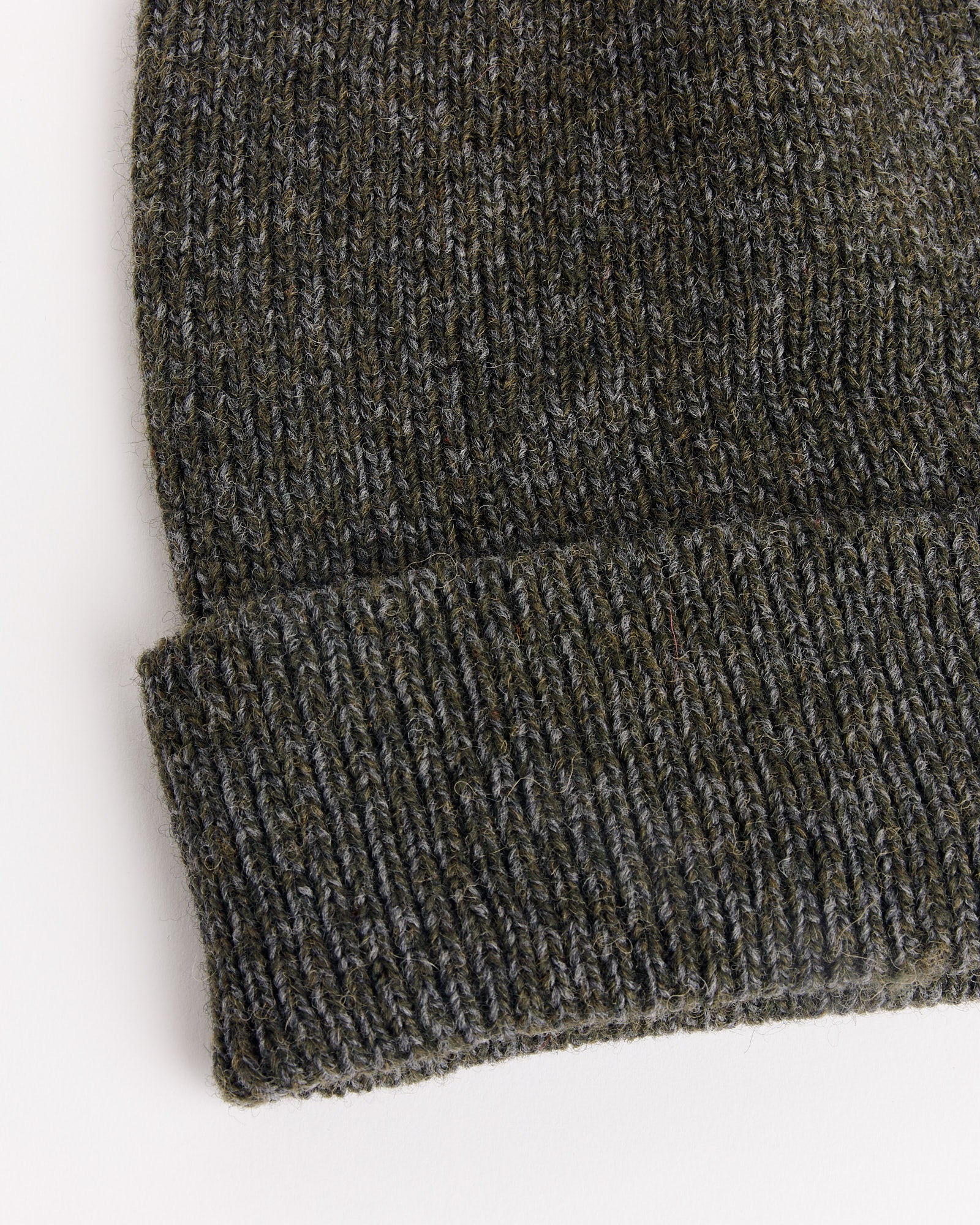 A close-up of the 7G Knit Cap in Melange Khaki by Still By Hand.