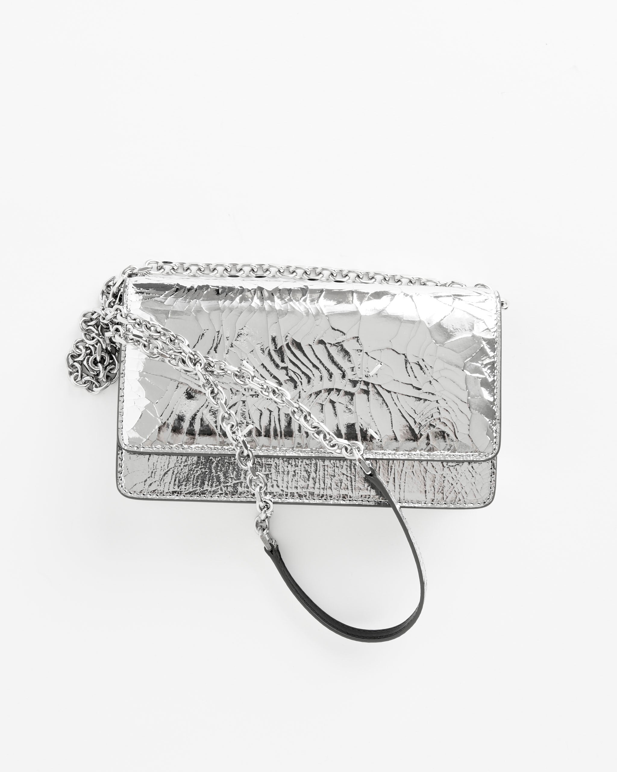 The Maison Margiela Broken Mirror Chain Wallet is a small metallic silver calfskin wallet with a crinkled texture, a long silver chain strap, and a decorative silver charm, shown on a plain white background.