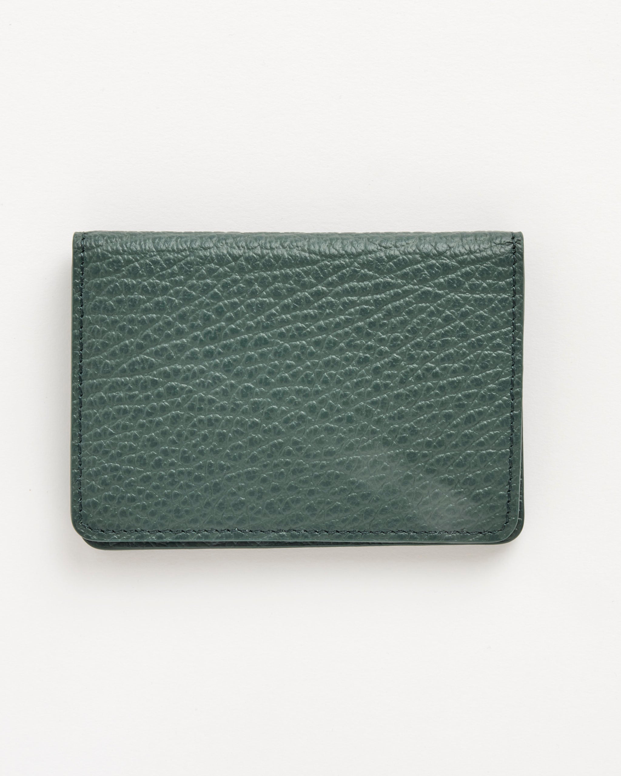 A closed, rectangular Maison Margiela Card Holder Slim 2 in bottle green with embossed grainy leather and a textured surface, shown on a plain white background.