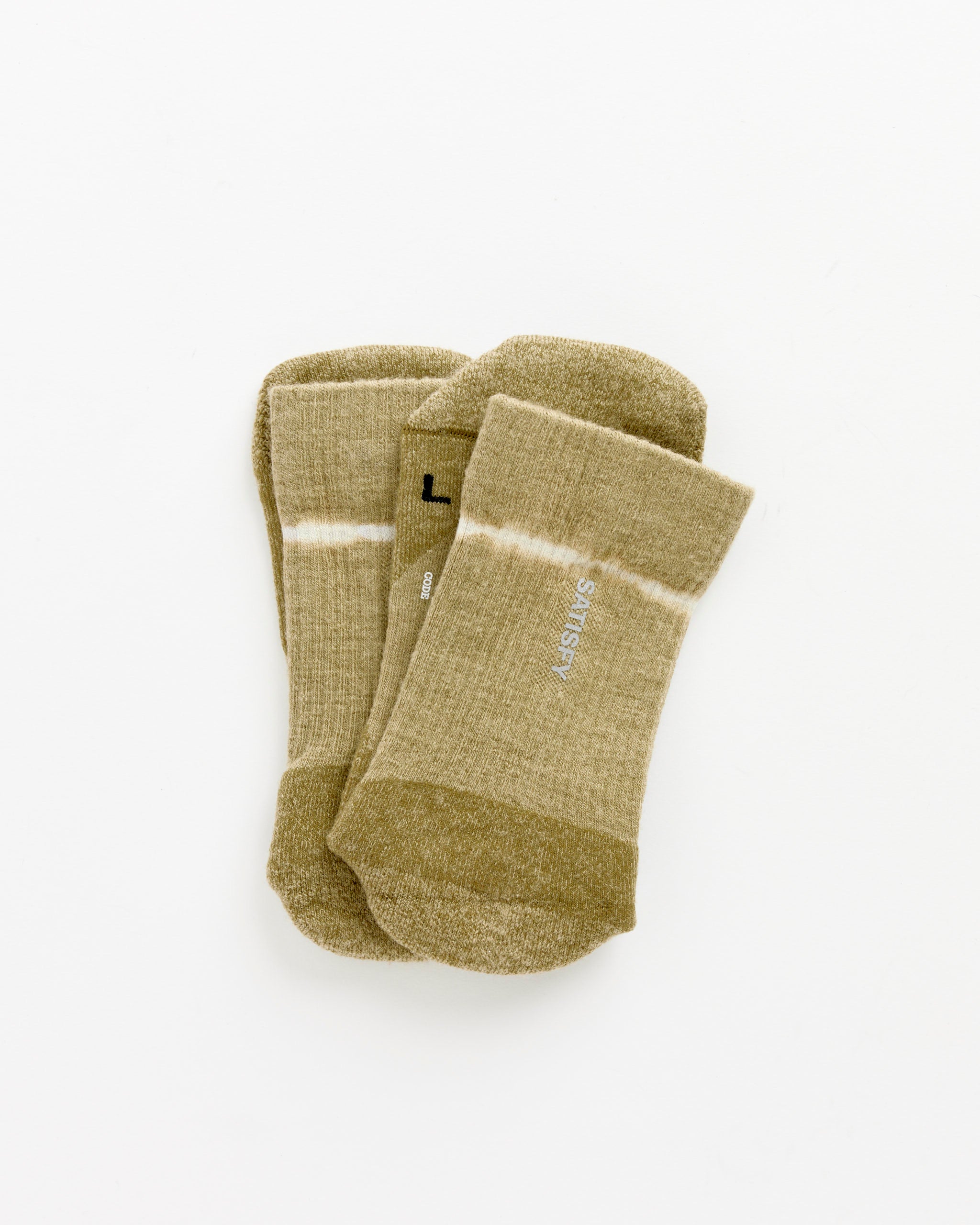 A pair of Satisfy Running Merino Nylon Tube Socks in Tie Dye Covert Green, featuring a subtle stripe and "SUNDAY" printed on one sock, laid flat against a white background.