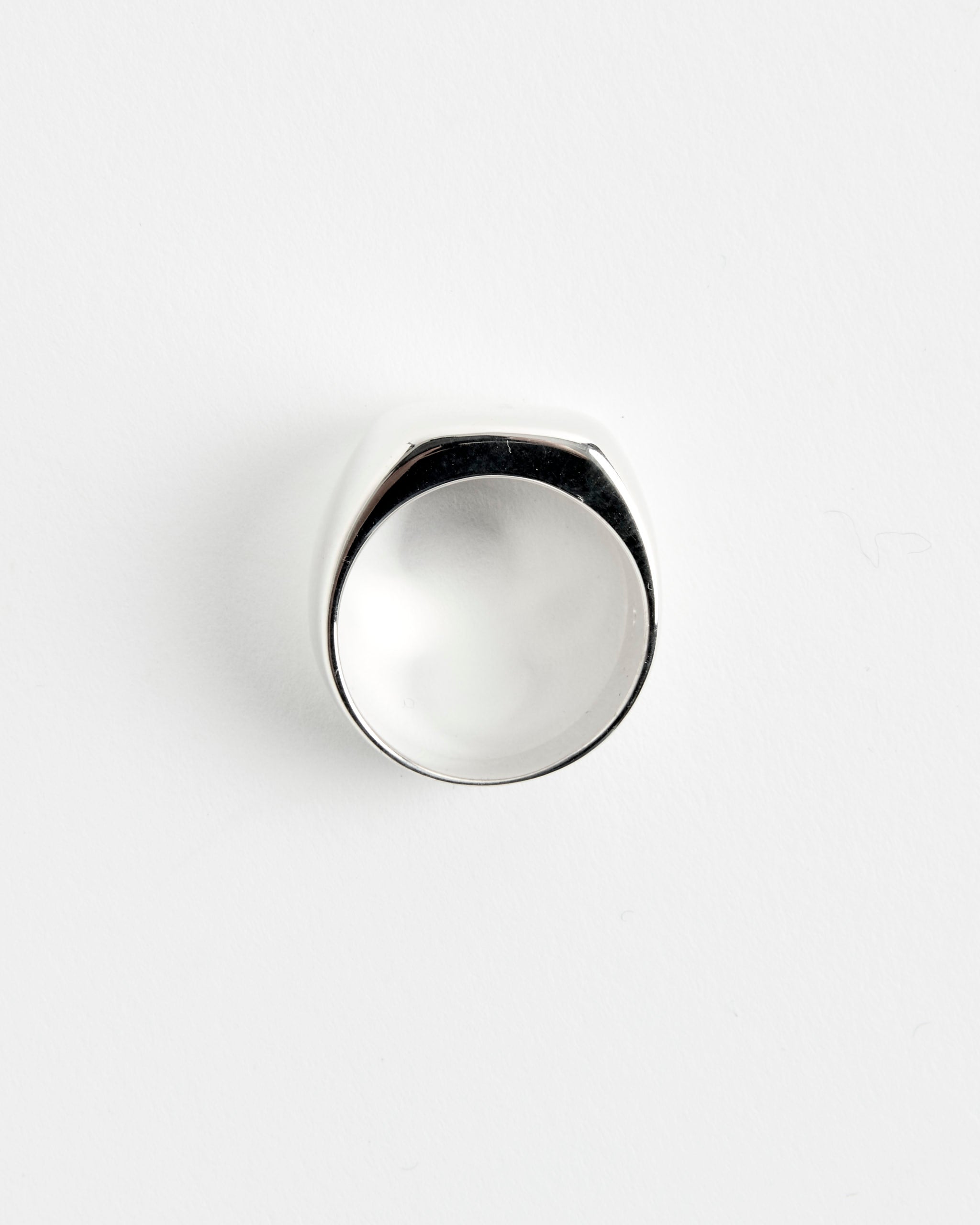 The Consigliere Ring by Sophie Buhai features a shiny, silver domed top and is displayed on a white background—perfect for any style. Contact our online chat for sizing help.