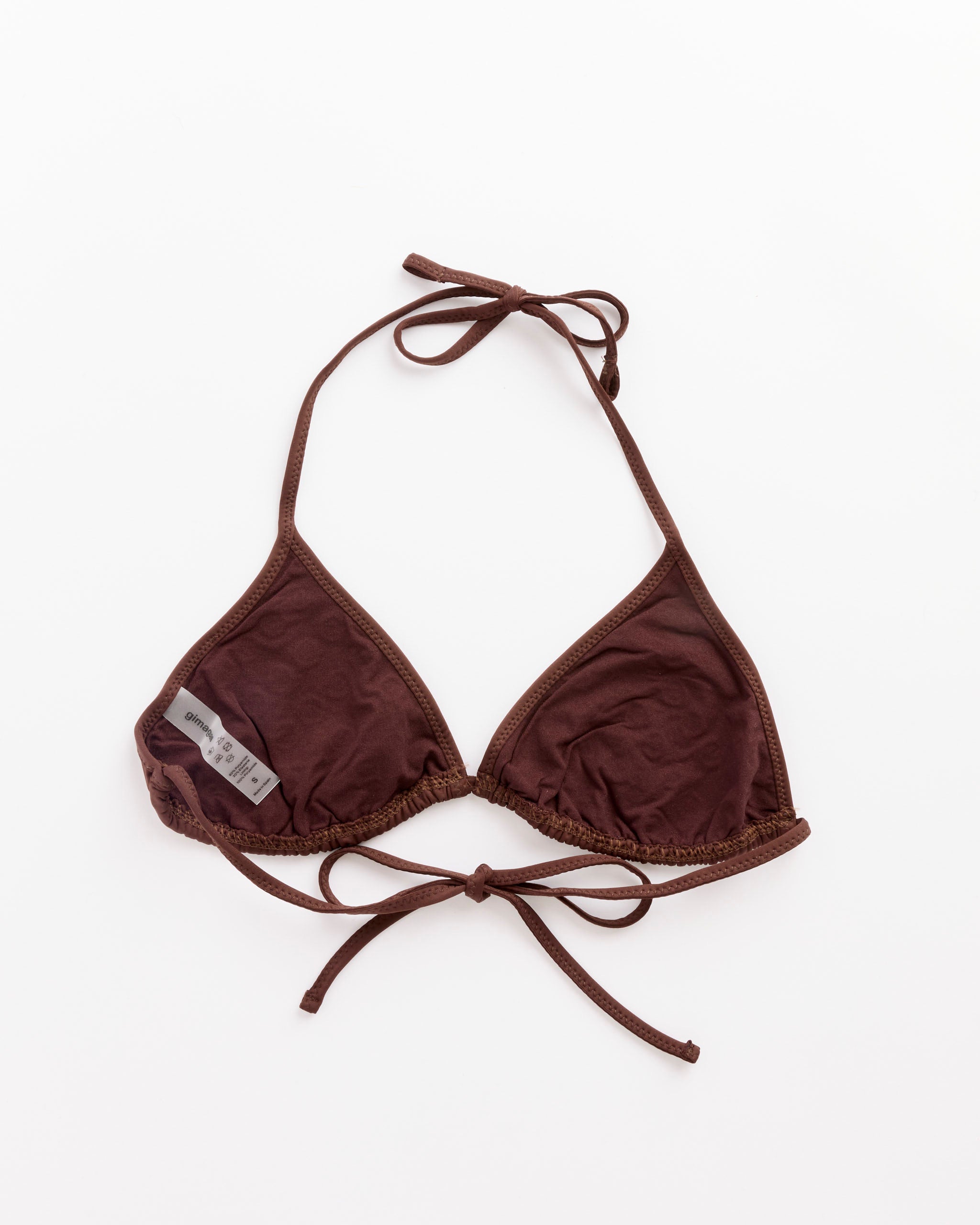 The Emily Bikini Top in Brown by Gimaguas features thin adjustable neck and back ties, a small fabric label on the left cup, and is displayed flat on a white background.