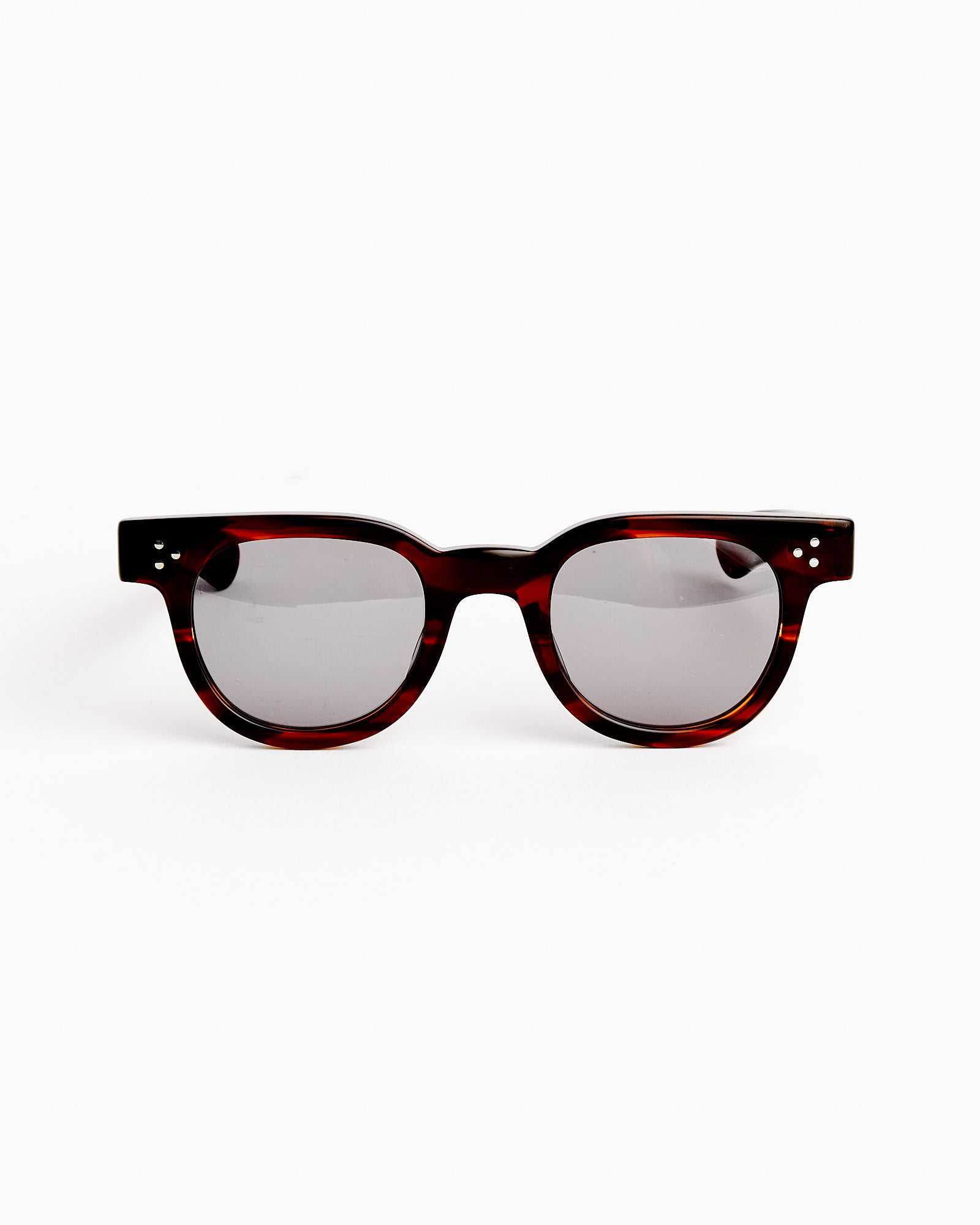 The Shady Character Frankie Sunglasses in Demi Amber/Grey feature round frames and dark lenses, shown on a plain white background—ideal for a perfect fit. For sizing help, please use our online chat support.