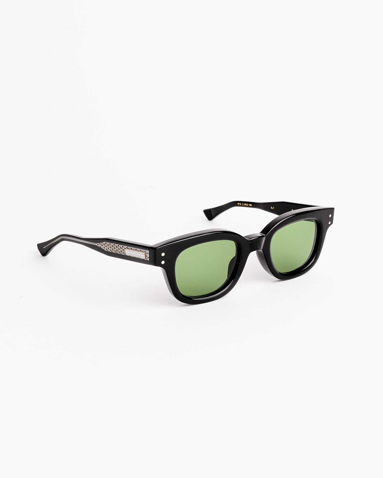 The Connolly Sunglasses in Black/GN-13 Green by Native Sons feature square black Japanese acetate frames, green-tinted lenses, and silver temple accents, displayed on a plain white background.