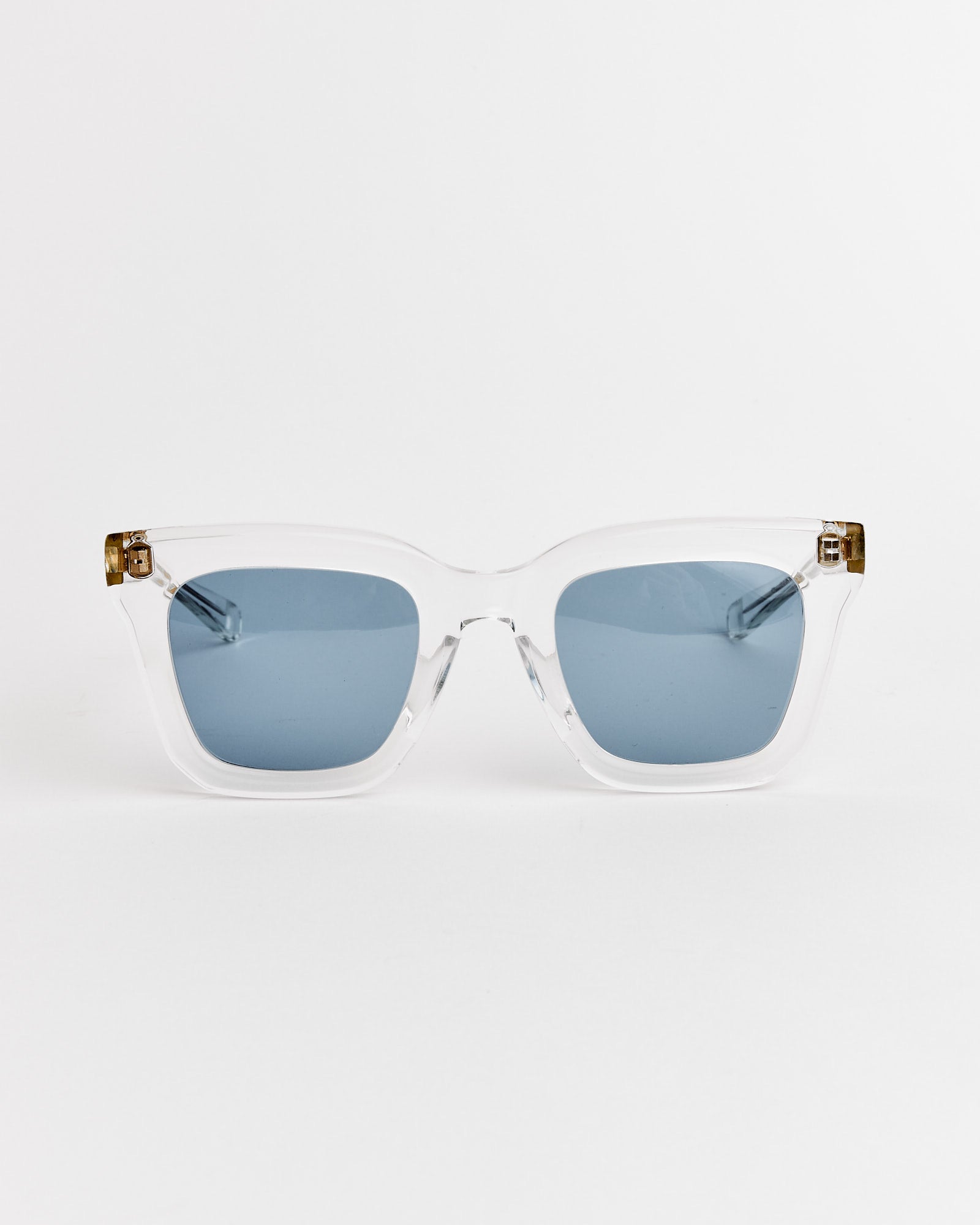 A pair of Native Sons Cornell Sunglasses in Clear Crystal/16K Gold with BL 31 Mid Blue lenses, crafted in the brand's signature style.