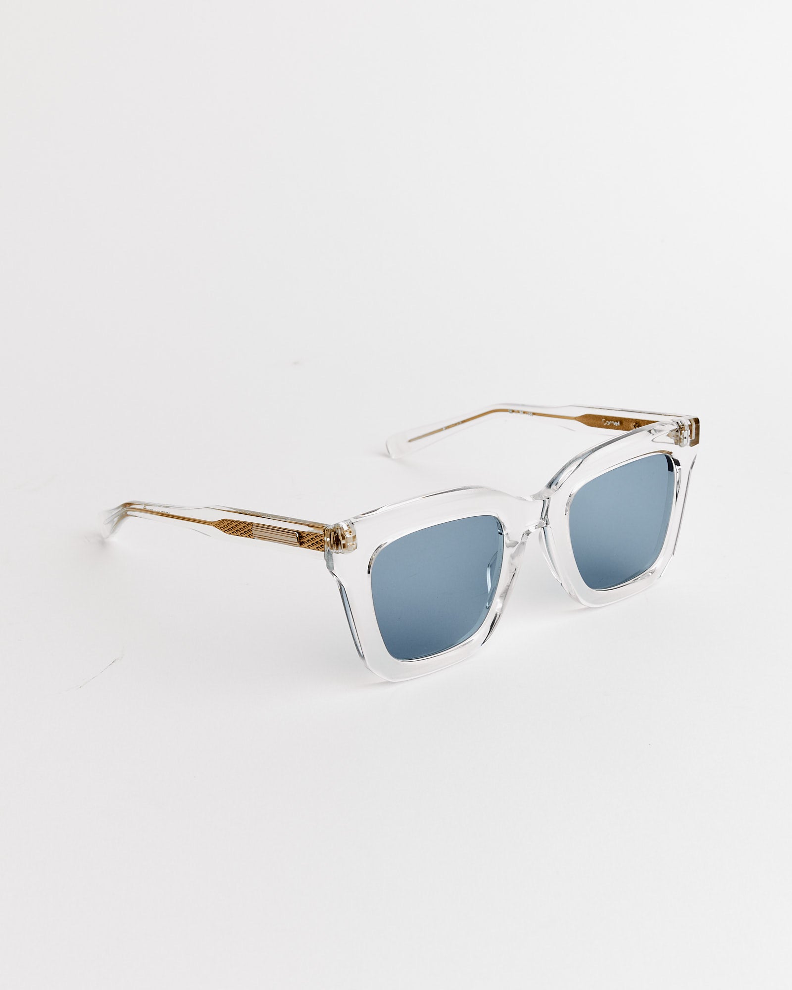 Cornell Sunglasses in Clear Crystal/16K Gold/BL 31 Mid Blue by Native Sons, featuring square blue-tinted lenses and gold accents on the arms, displayed on a white background.