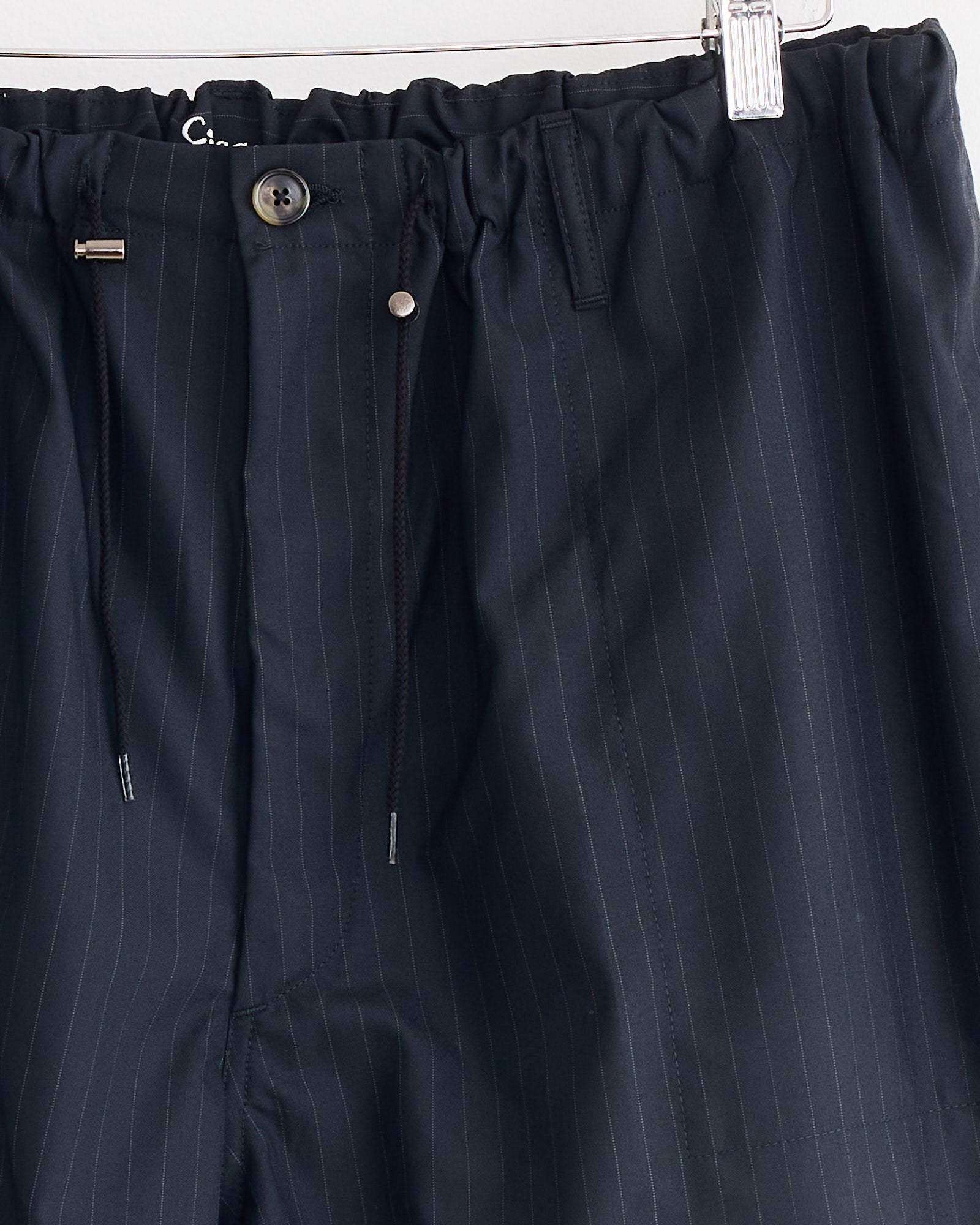 A close-up of the Sillage Circular Fatigue Short Pant, crafted from tropical wool and made in Japan.