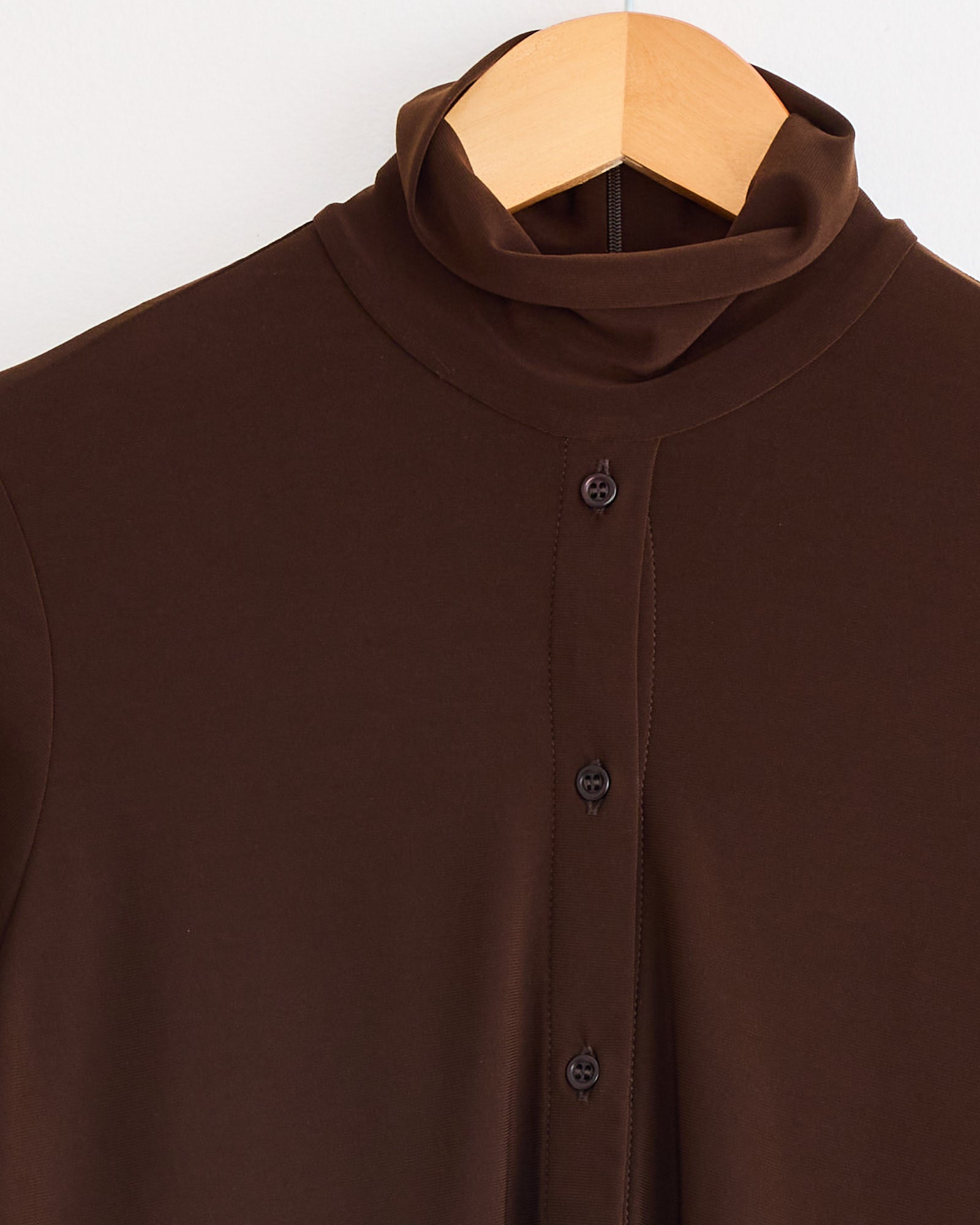 The Button Down Rodin Blouse in Brown by Beaufille features a slim fit and lightweight stretch fabric for a comfortable, stylish look.