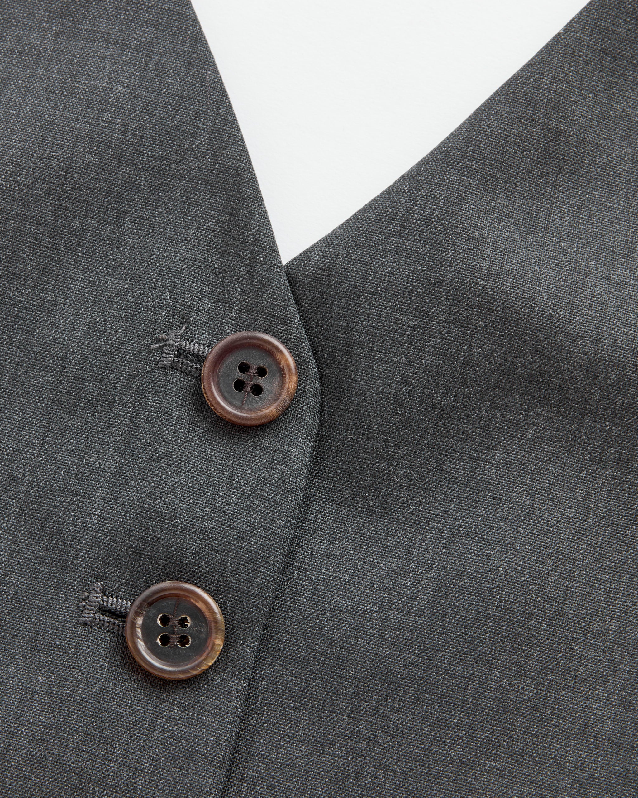 Close-up of Amomento's Wool Halterneck Top in Charcoal, made from 100% wool, featuring a v-shaped neckline and smooth polyester lining.