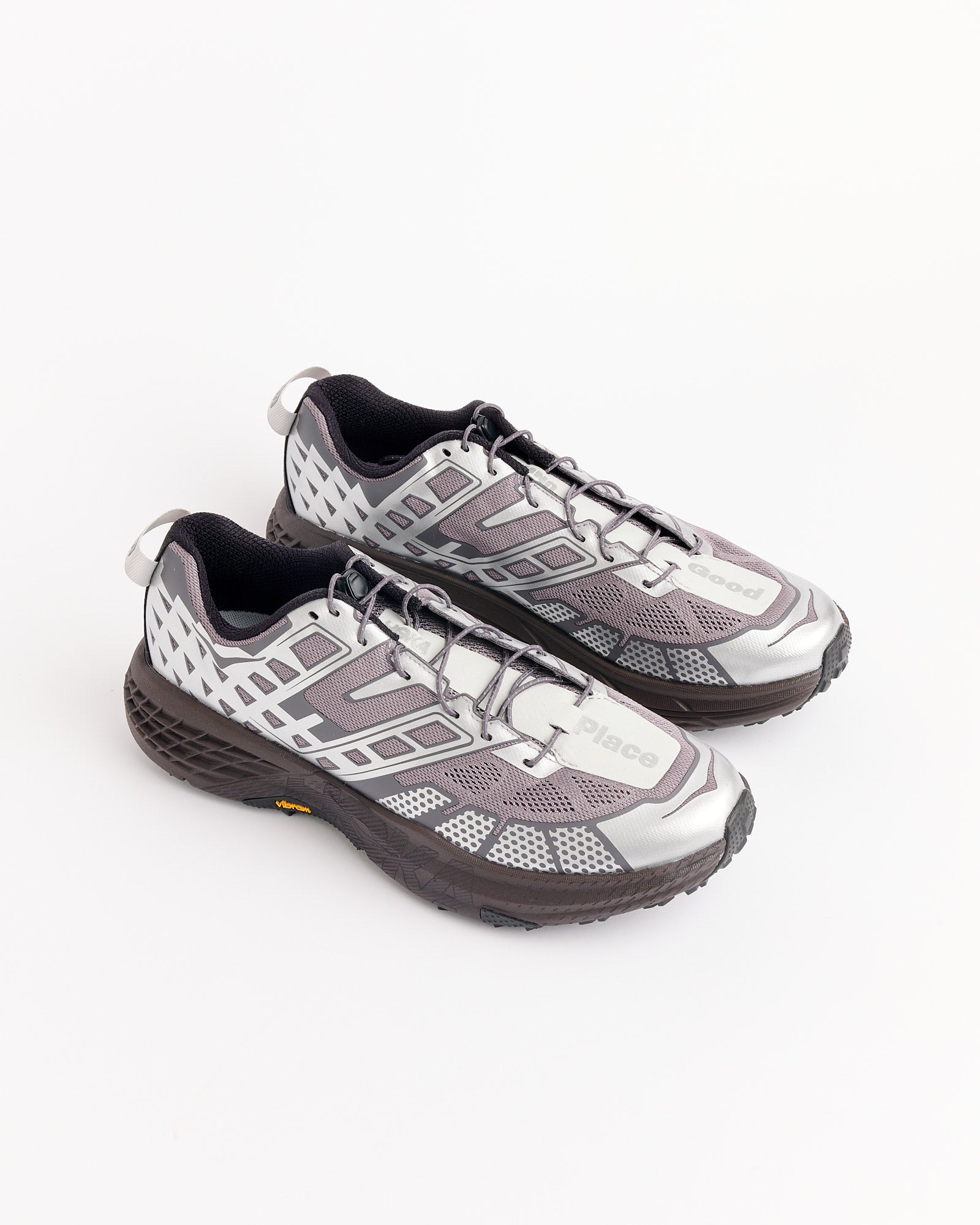 The Hoka SPEEDGOAT 2 UNNA in Astral/Galaxy features mesh detailing, black laces, and textured black soles, shown on a white background. For sizing questions, chat with us online at Mohawk General Store.