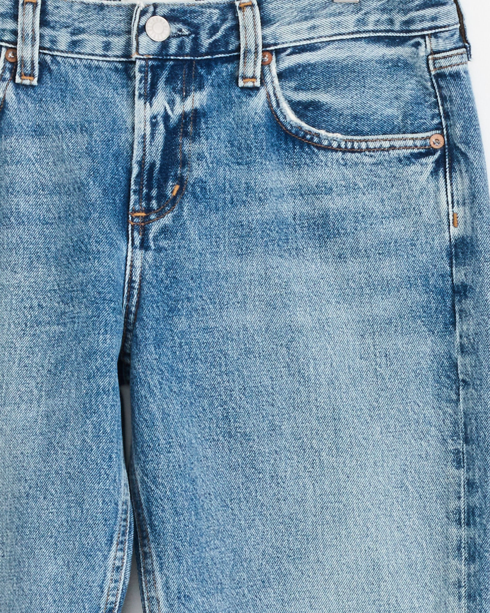 A close-up of the Low Rise Slim in Downtown jeans by AGOLDE, highlighting the fit and detailing that suit any style.