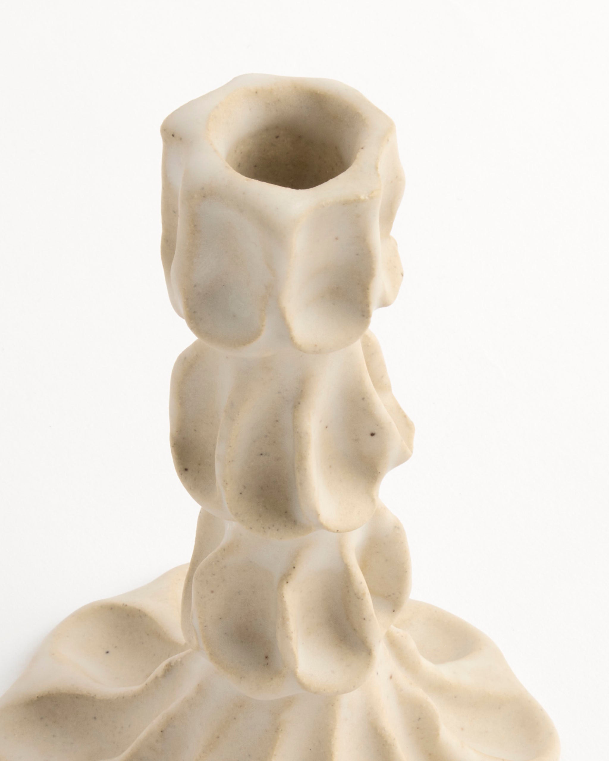 A close-up of a Large Candle Stick by Carma Ferrier Ceramics, featuring a handmade, irregular wavy form and textured surface, photographed against a white background.