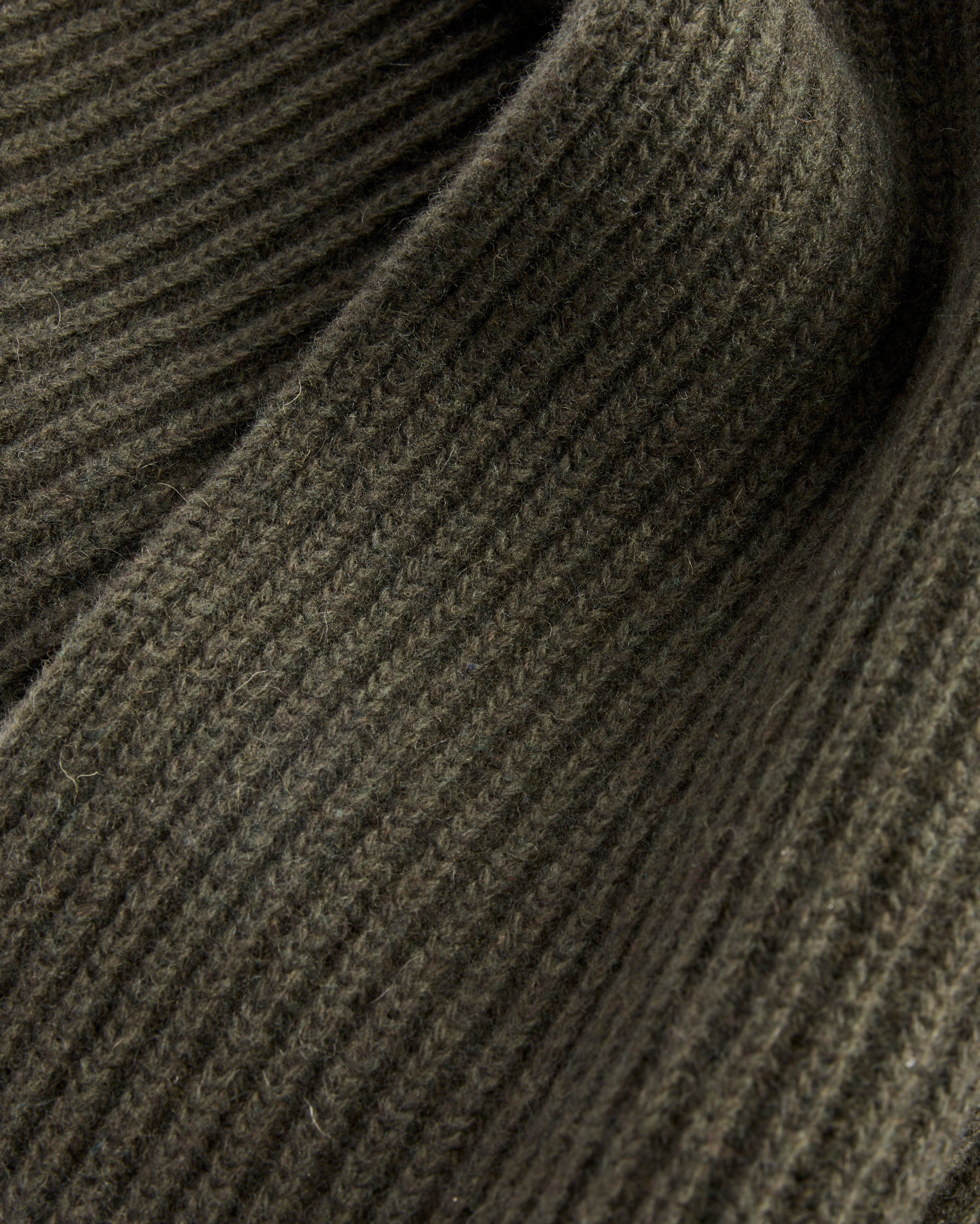 Close-up of the MM6 Maison Margiela Scarf in Khaki, highlighting the ribbed wool blend knit and detailed stitch texture.