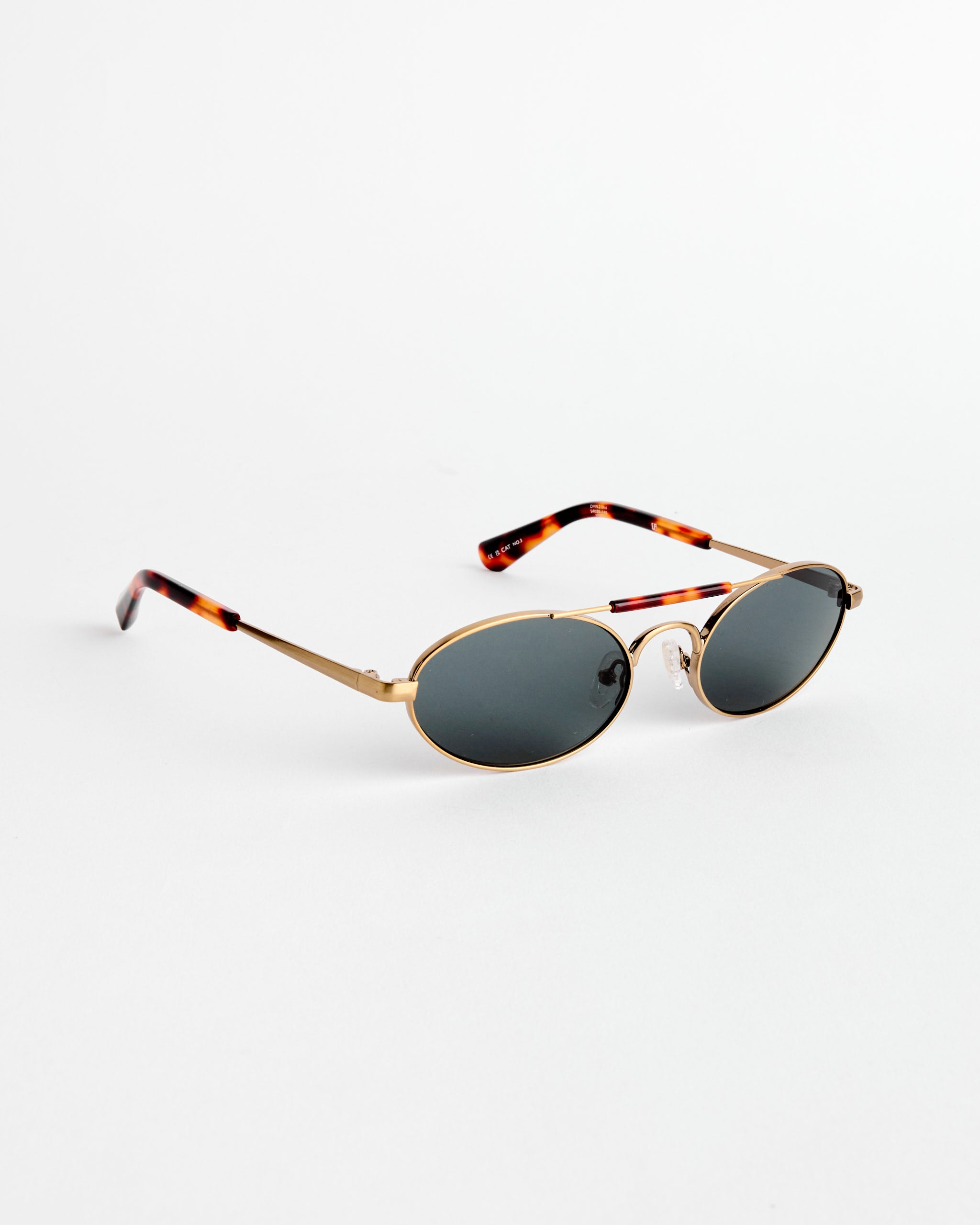 Dries Van Noten Sunglasses in Gold/T-Shell/Honey C4 feature oval gold metal frames, dark lenses, and tortoiseshell arms, shown against a plain white background.