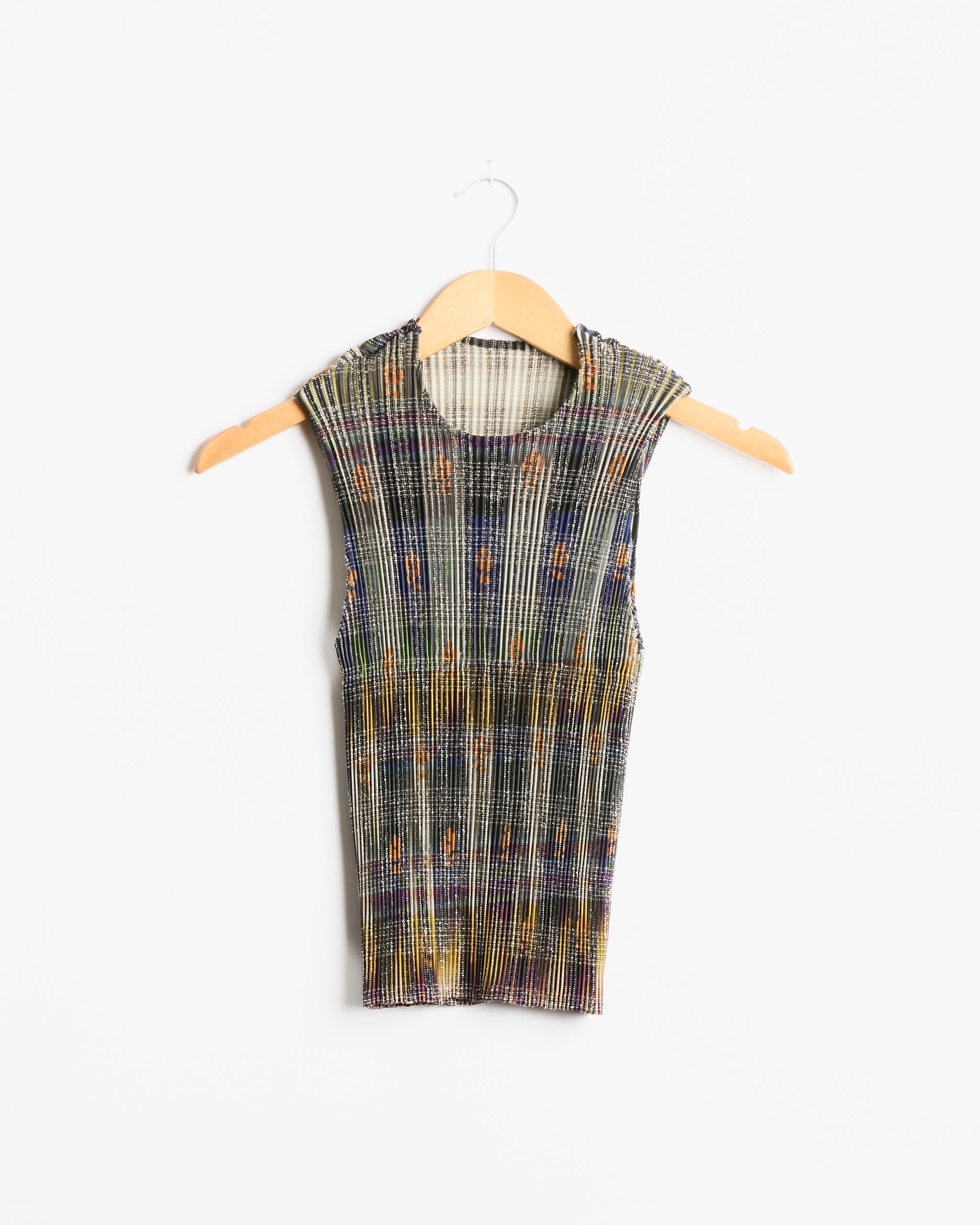 The Thelma Top in Heige by Julia Heuer, a sleeveless, multicolored ribbed knit shirt, is displayed on a wooden hanger against a plain white background.