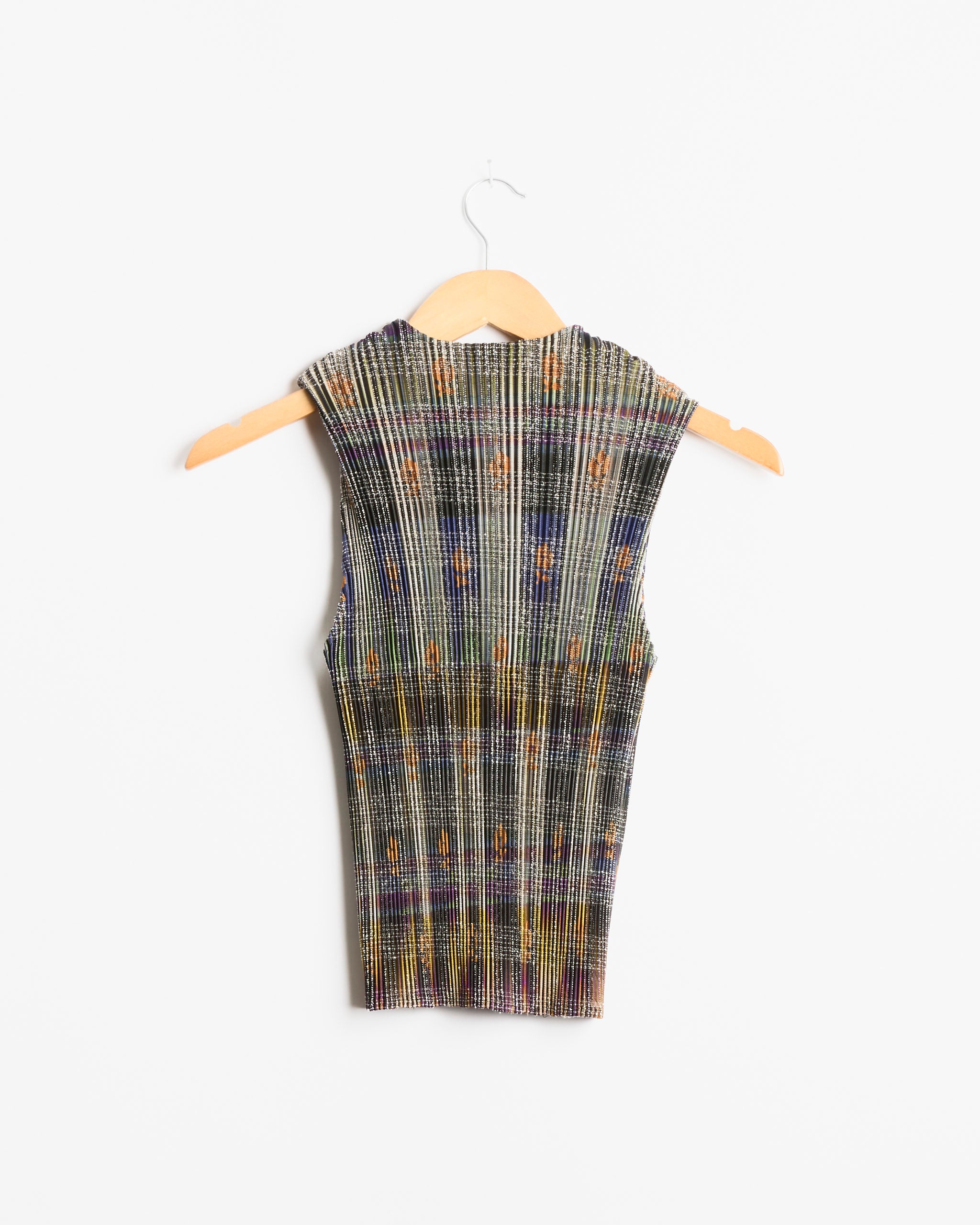Thelma Top in Heige by Julia Heuer, a sleeveless, multicolored knit top with a high neckline, displayed on a wooden hanger against a white background.